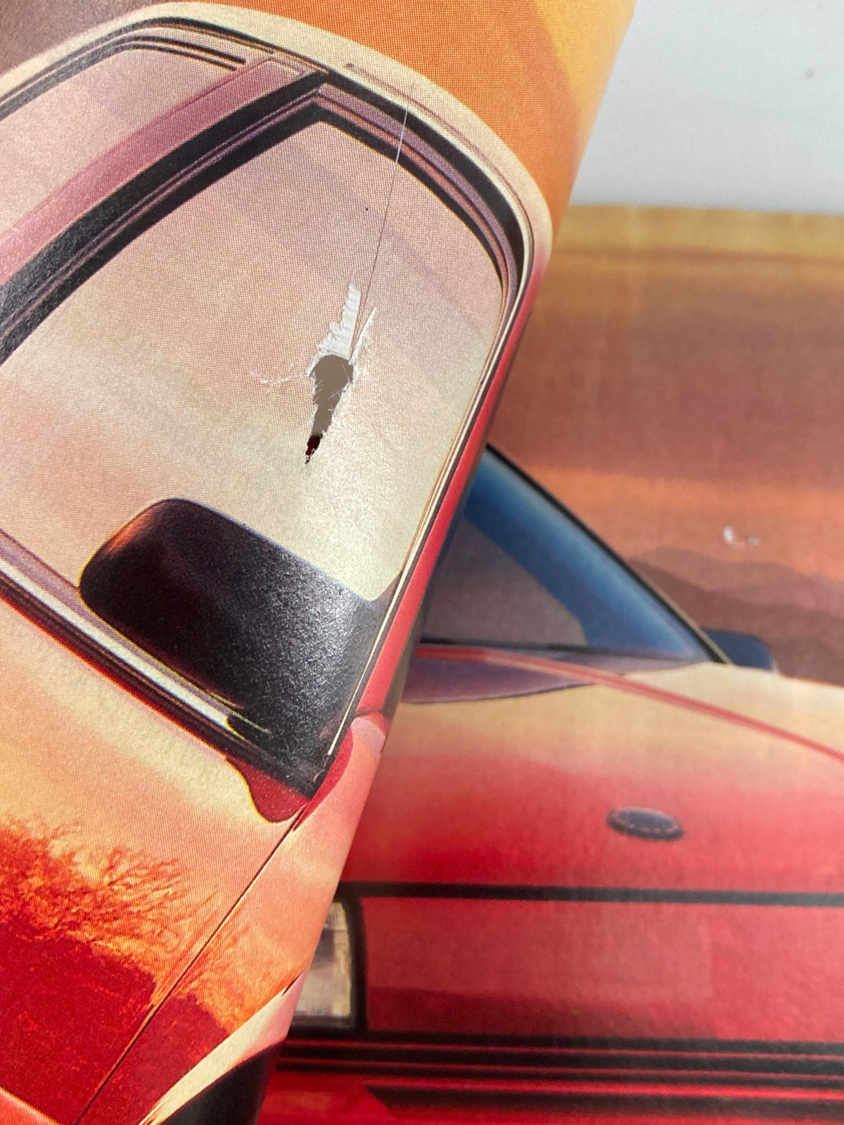 Close-up of a tear in the pages of Road & Track Magazine March 1989, highlighting the vintage condition of this collectible issue featuring the Nissan 300ZX.