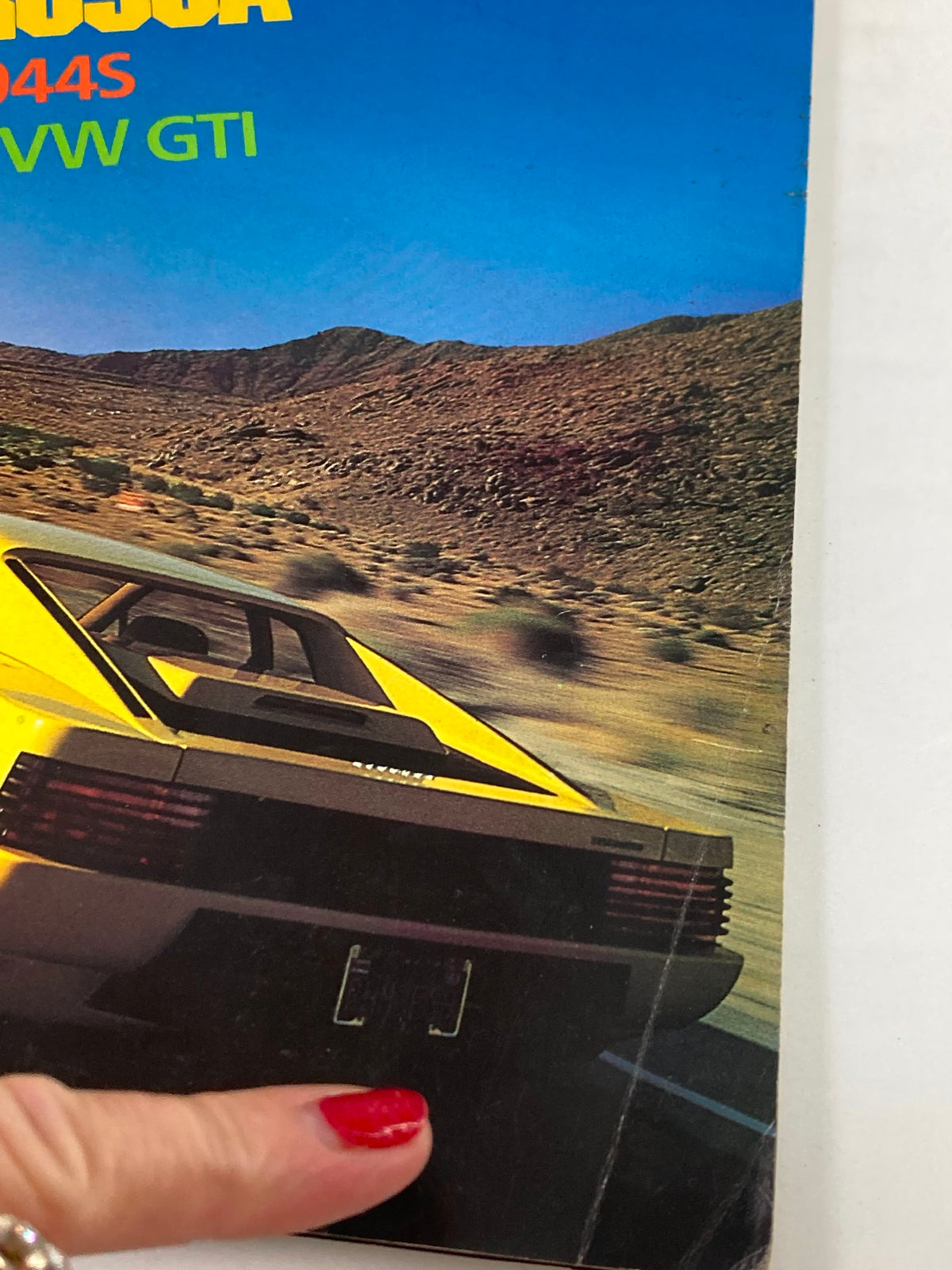 Close-up of the rear section of the VTG Automobile Magazine October 1986 Vol 1 #7 featuring the Ferrari Testarossa, highlighting its distinctive features on the magazine cover.