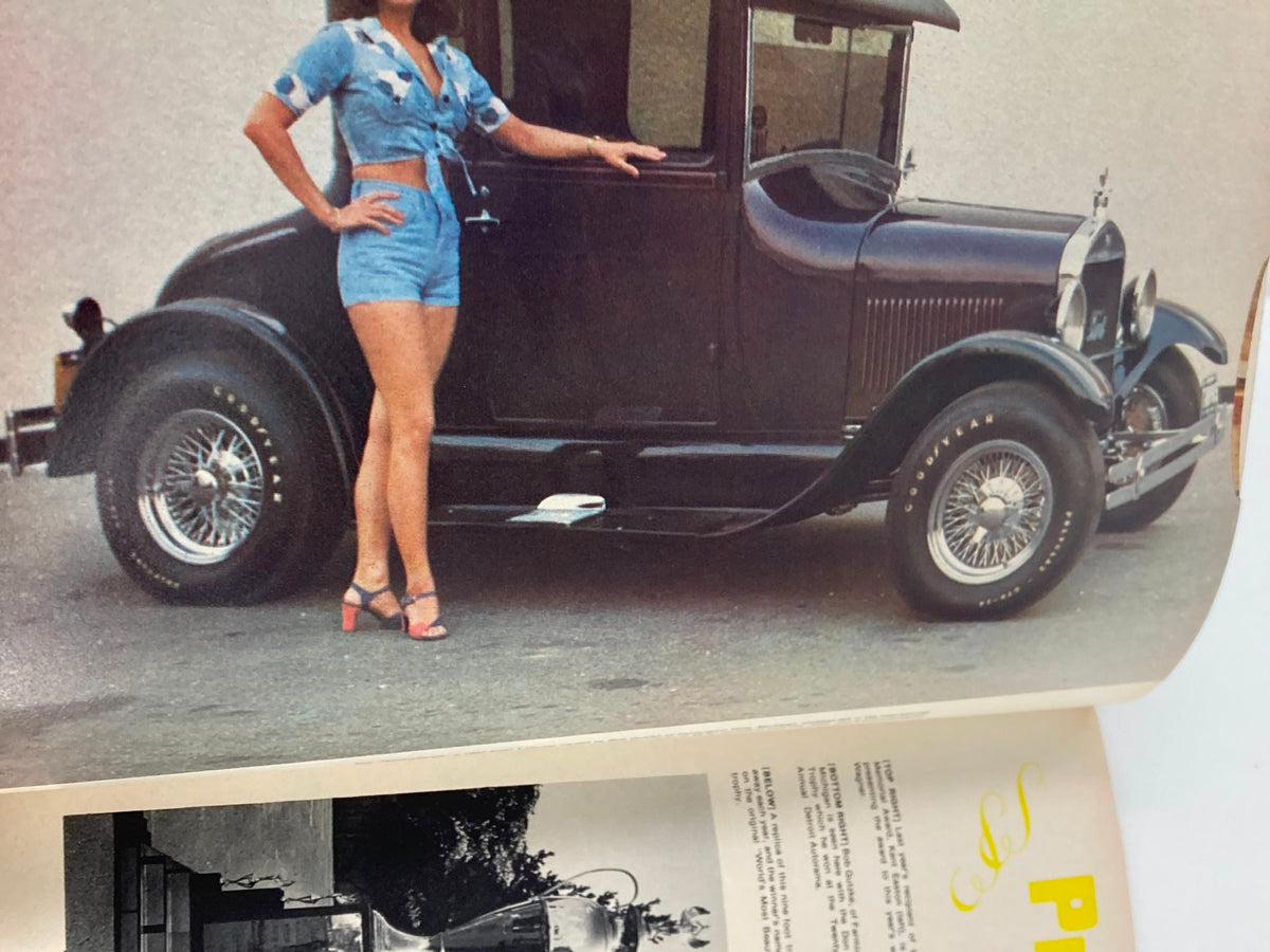 1976 Annual Spring Edition Hot Rod Showdown displaying a classic black vintage car alongside a model, capturing the essence of 1920s automobile design.