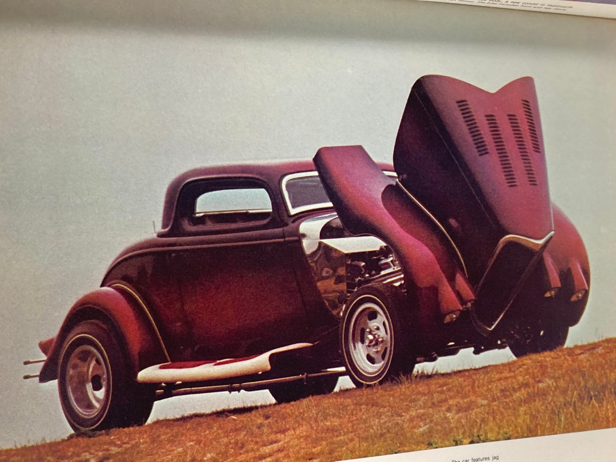 1976 Annual Spring Edition Hot Rod Showdown featuring a classic red car with an open hood, illustrating the detailed mechanics and vintage styling of 1930s rwd vehicles.