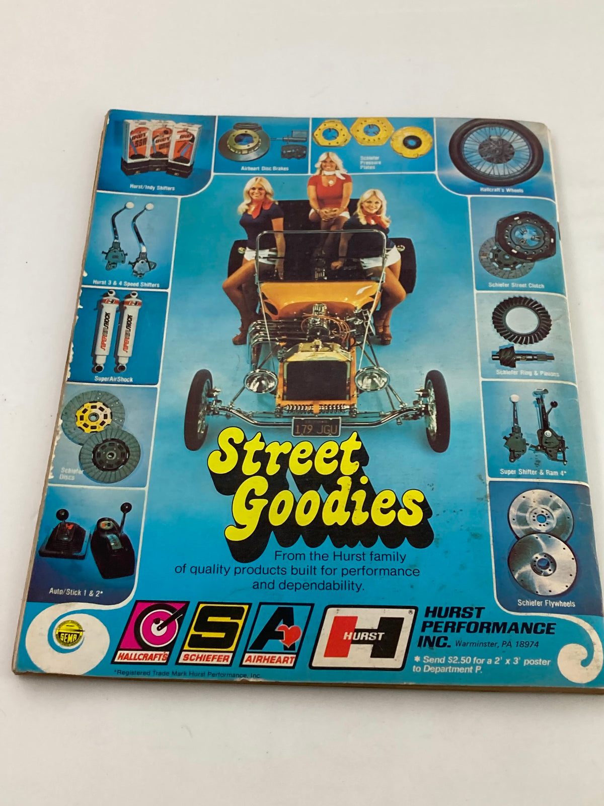 1976 Annual Spring Edition Hot Rod Showdown with the cover of the 'Street Goodies' catalog highlighting performance products and showcasing vintage car accessories from Hurst Performance.