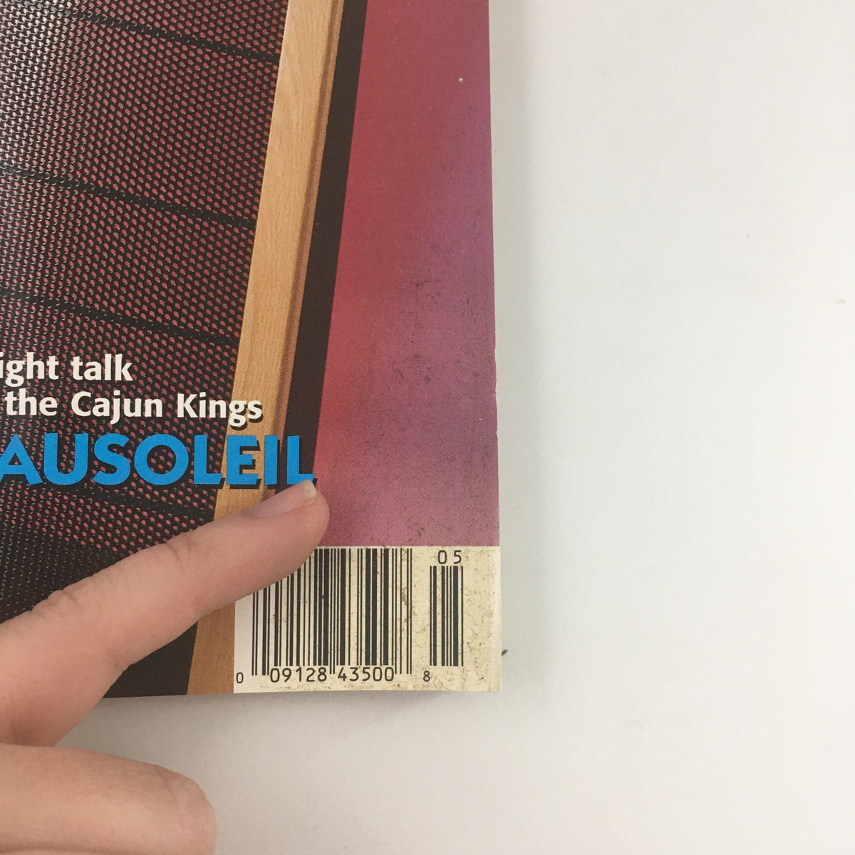 Close-up view of the Stereophile Magazine May 1997, focusing on 'Straight talk with the Cajun Kings Beausoleil' text and the barcode, showcasing details relevant to collectors and music enthusiasts.