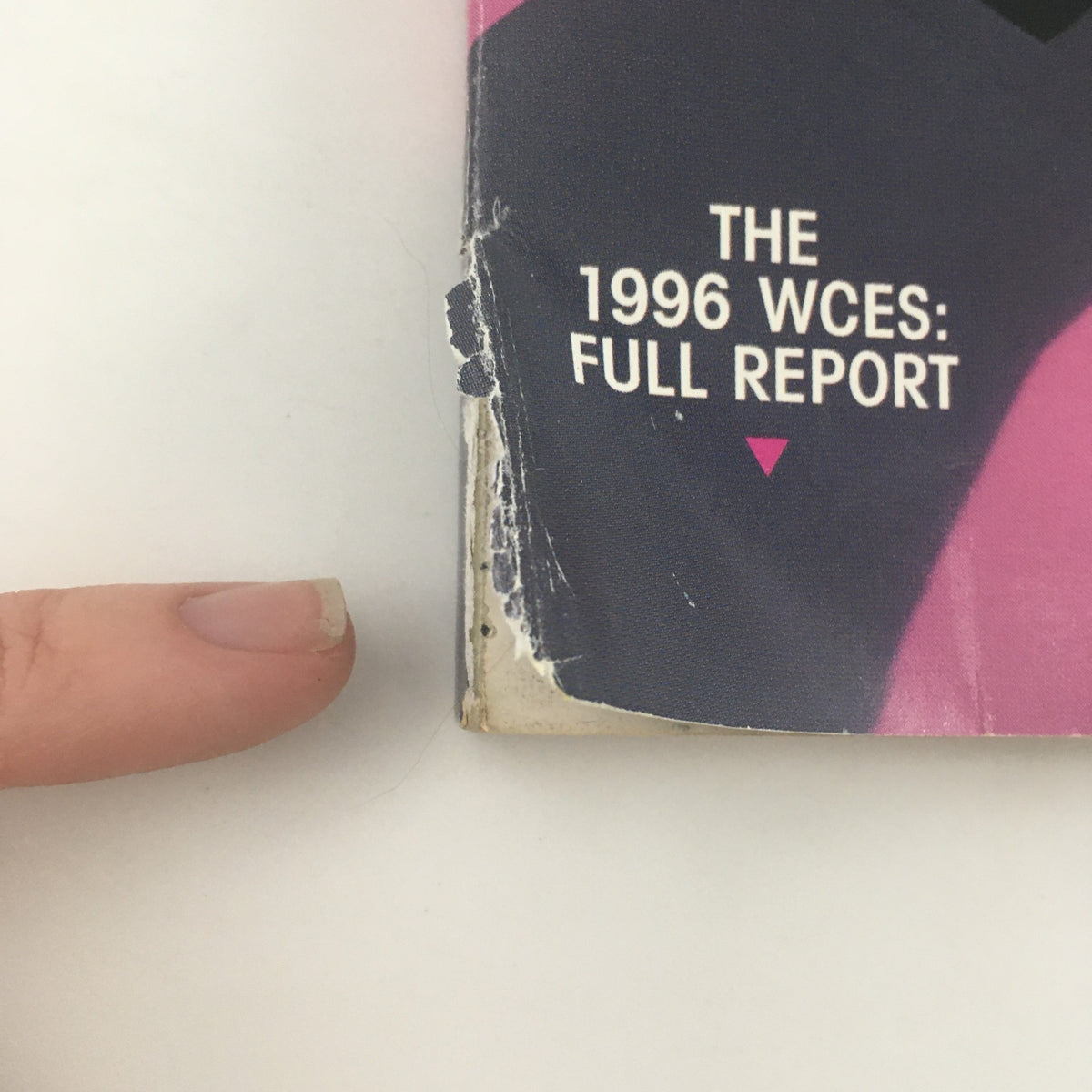 Close-up image of the side of Stereophile Magazine April 1996 showing text about the 1996 WCES: Full Report with wear indicating vintage condition.