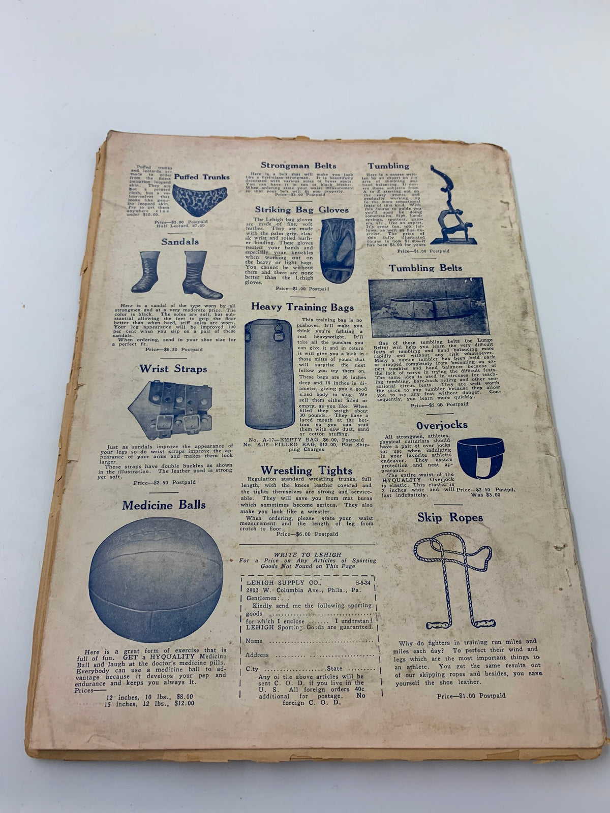 Back cover of VTG The Arena and Strength Magazine featuring advertisements for strength training equipment and products.