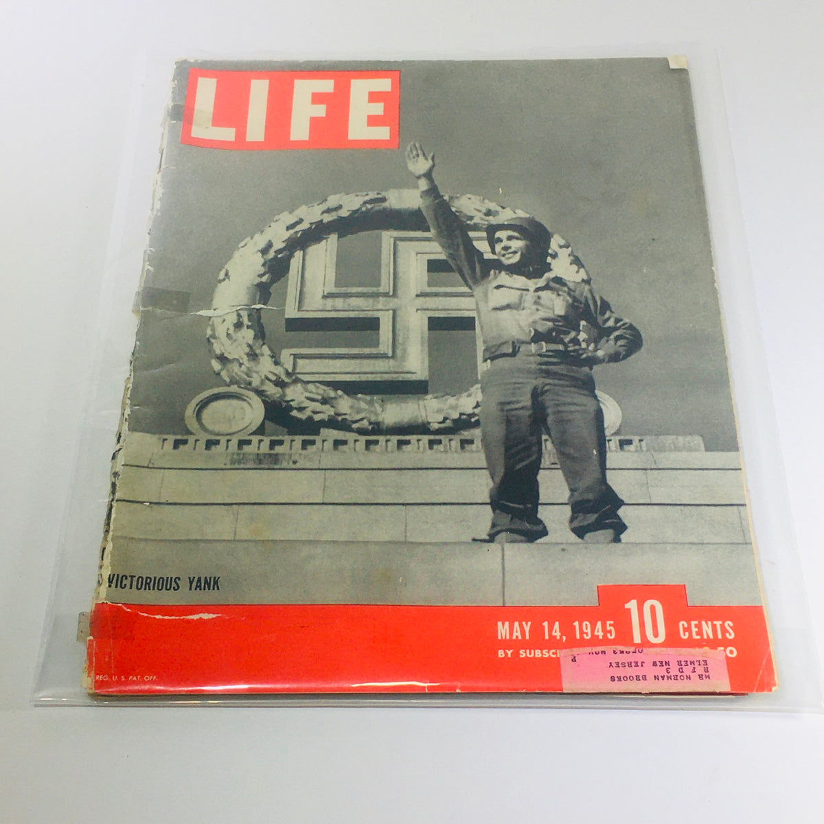 Vintage Life Magazine cover from May 14, 1945, featuring the 'Victorious Yank' with a backdrop symbolizing the end of World War II in Europe. This issue captures the historical moment of military victory and the spirit of post-war America.