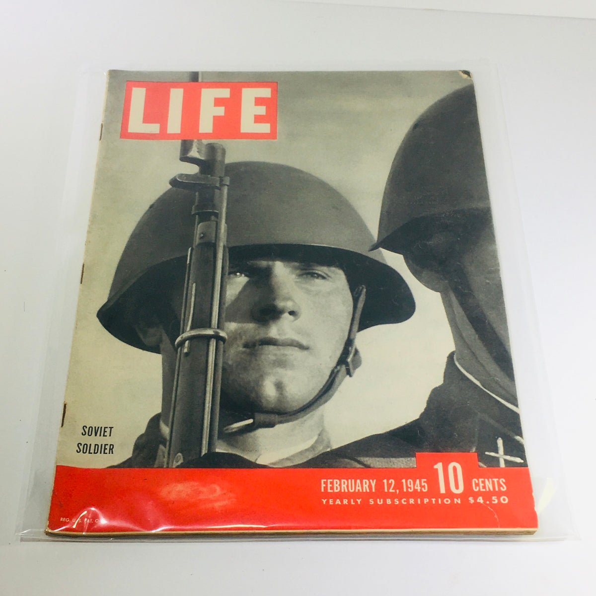 Cover of VTG Life Magazine dated February 12, 1945, featuring a Soviet soldier with a rifle, highlighting the theme of 'Hitler's Reich in 53 Photos'.