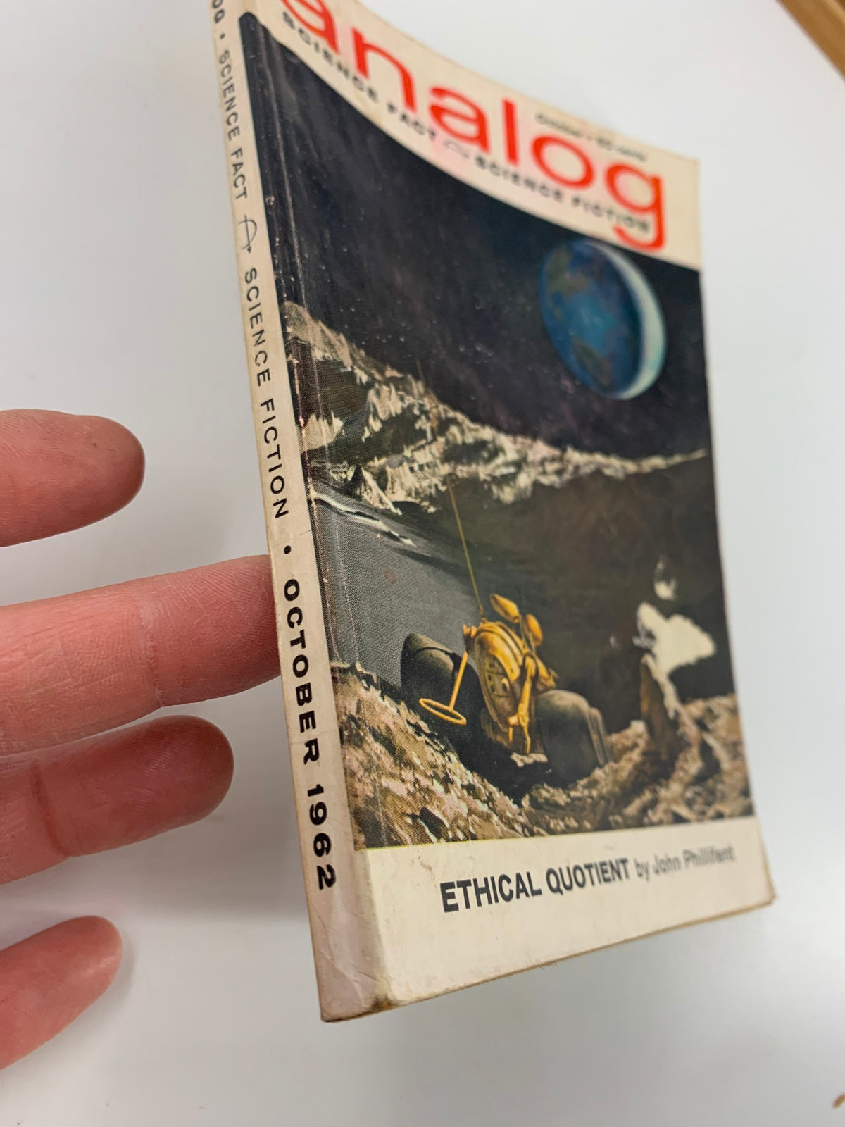 Cover of the VTG Analog Magazine October 1962 featuring the article 'Ethical Quotient' by John Phillifent, showcasing a science fiction theme with an illustration of a lunar landscape.