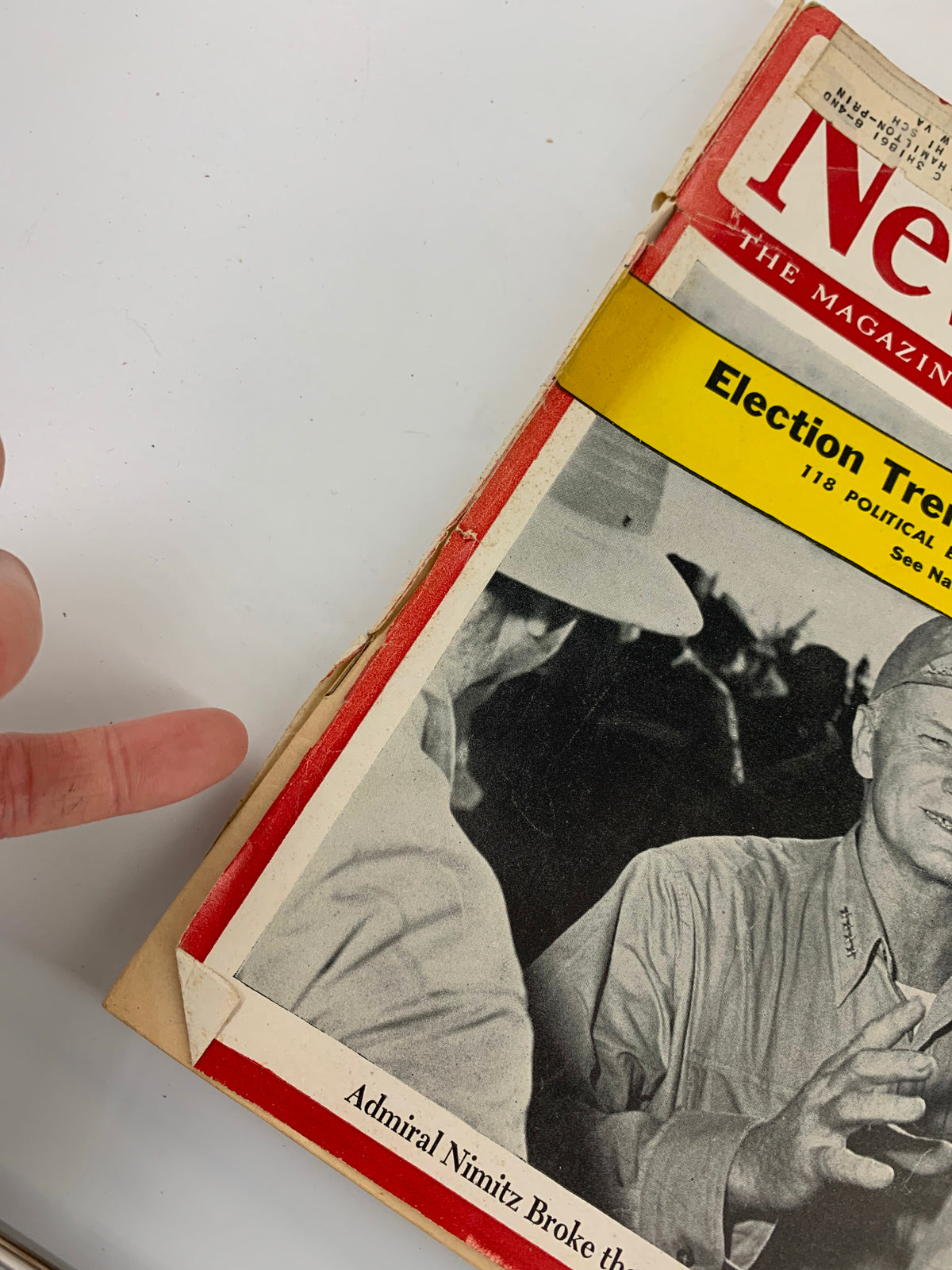 Close-up view of the edge of the VTG Newsweek Magazine from November 6, 1944 showcasing Admiral Nimitz, with visible wear and a label on the cover.