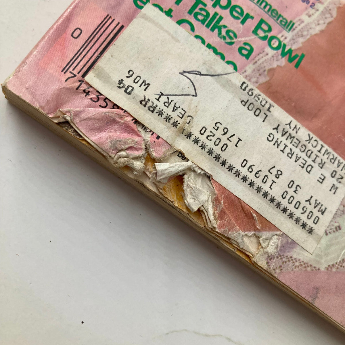 Close-up of the edge of TV Guide Magazine January 24 1987, showing wear and tear typical for a vintage magazine.