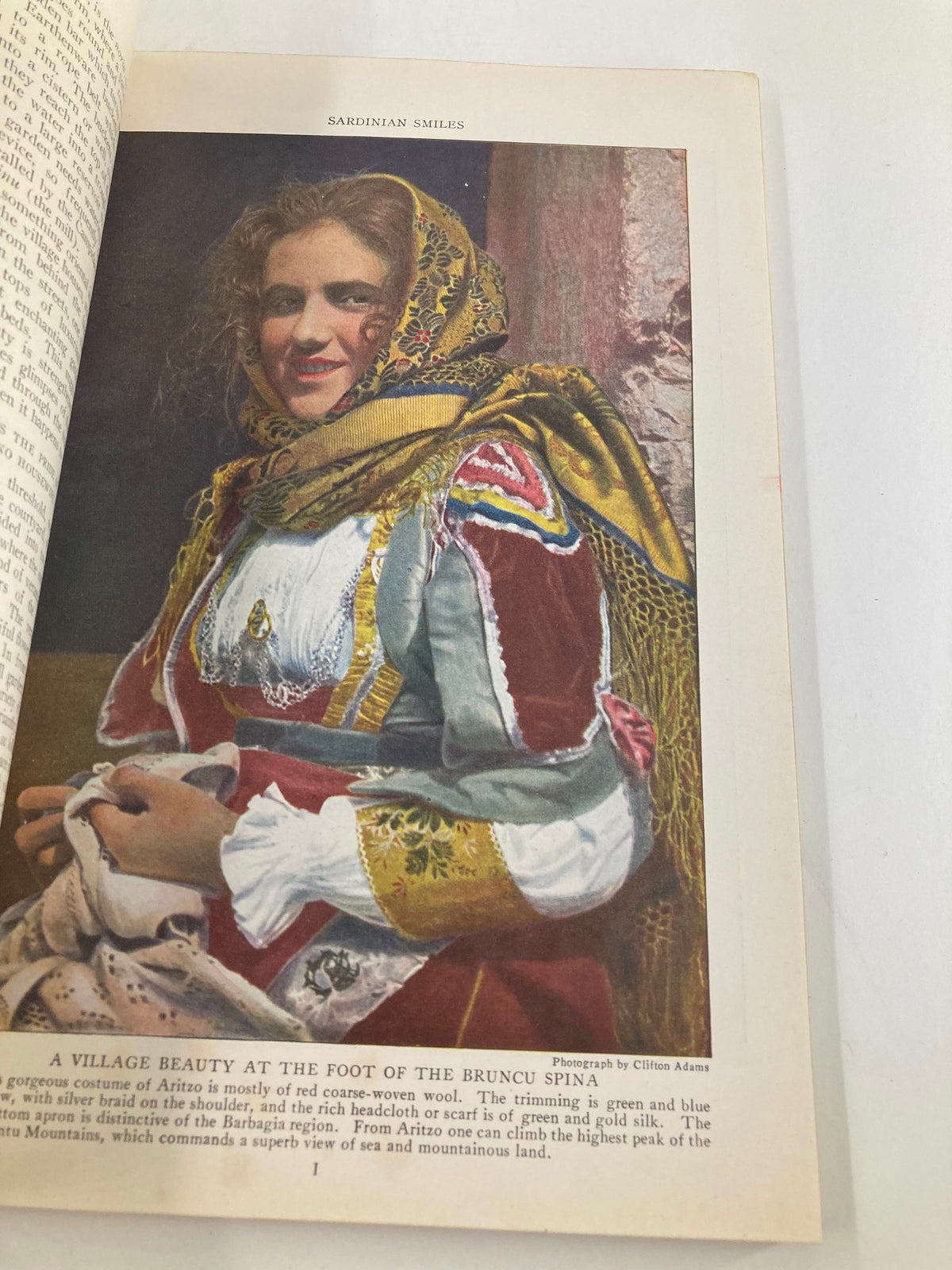 Portrait of a Sardinian woman in traditional attire from VTG The National Geographic Magazine January 1923, highlighting cultural heritage and craftsmanship.