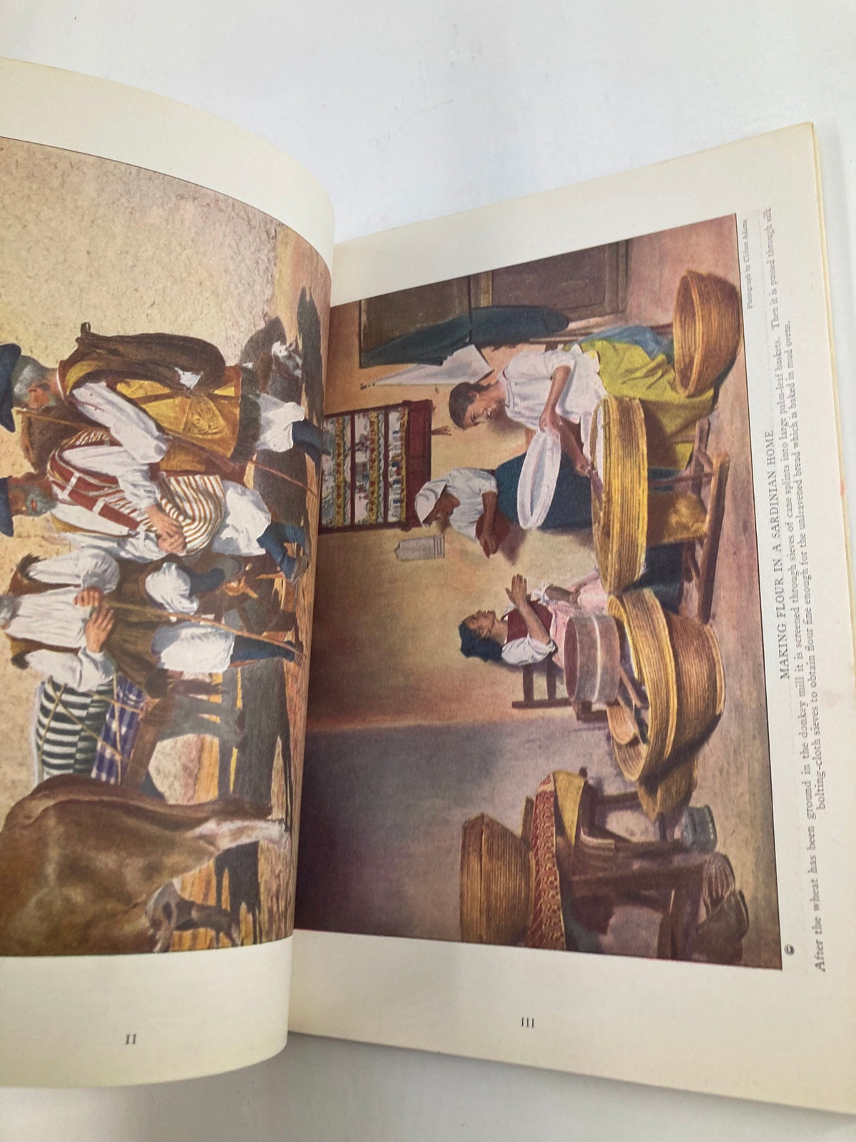 Scene depicting Sardinian people engaged in daily activities, illustrated in VTG The National Geographic Magazine January 1923, focusing on local customs and lifestyle.