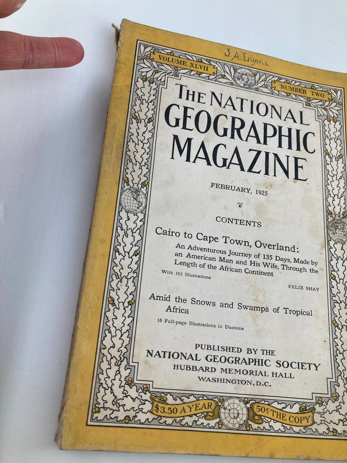 Close-up view of Vintage The National Geographic Magazine February 1925 front cover highlighting the contents including articles on Africa's landscapes.