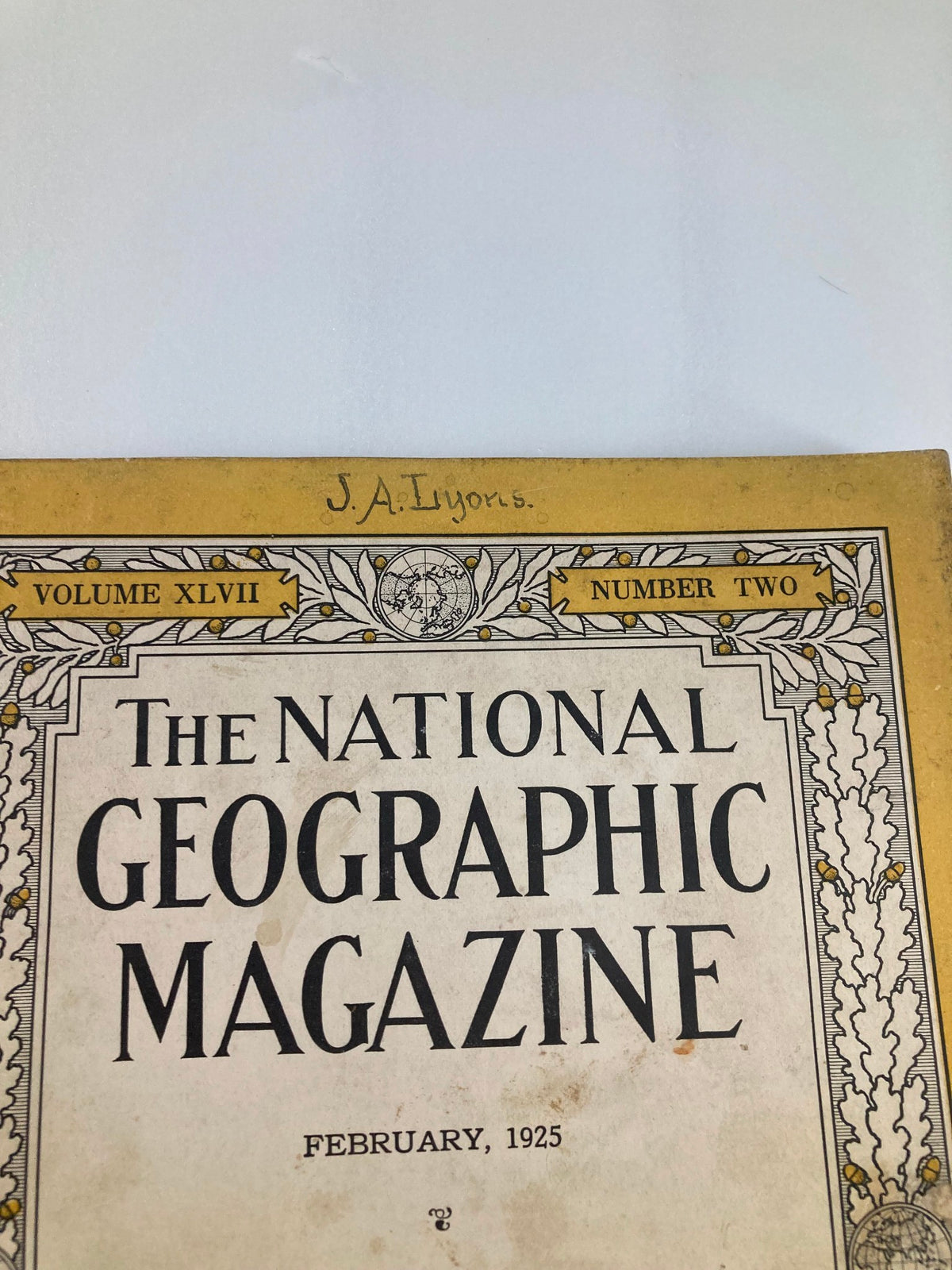 Detail of the Vintage The National Geographic Magazine February 1925 cover featuring a handwritten name, capturing the essence of its vintage appeal.