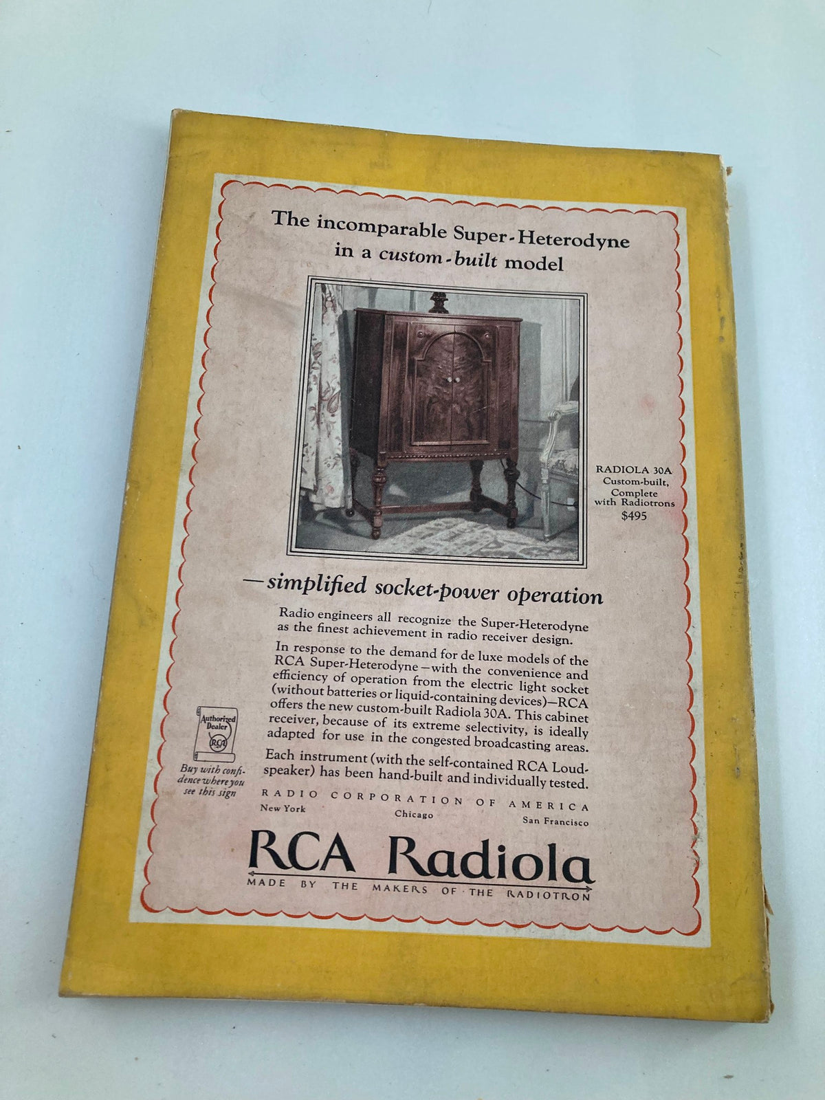 Back cover of the January 1928 National Geographic Magazine featuring an advertisement for the RCA Radiola radio model 304, illustrating the Super-Heterodyne technology with a vintage aesthetic. Collectible item emphasizes the era's innovative spirit and connection to technology.