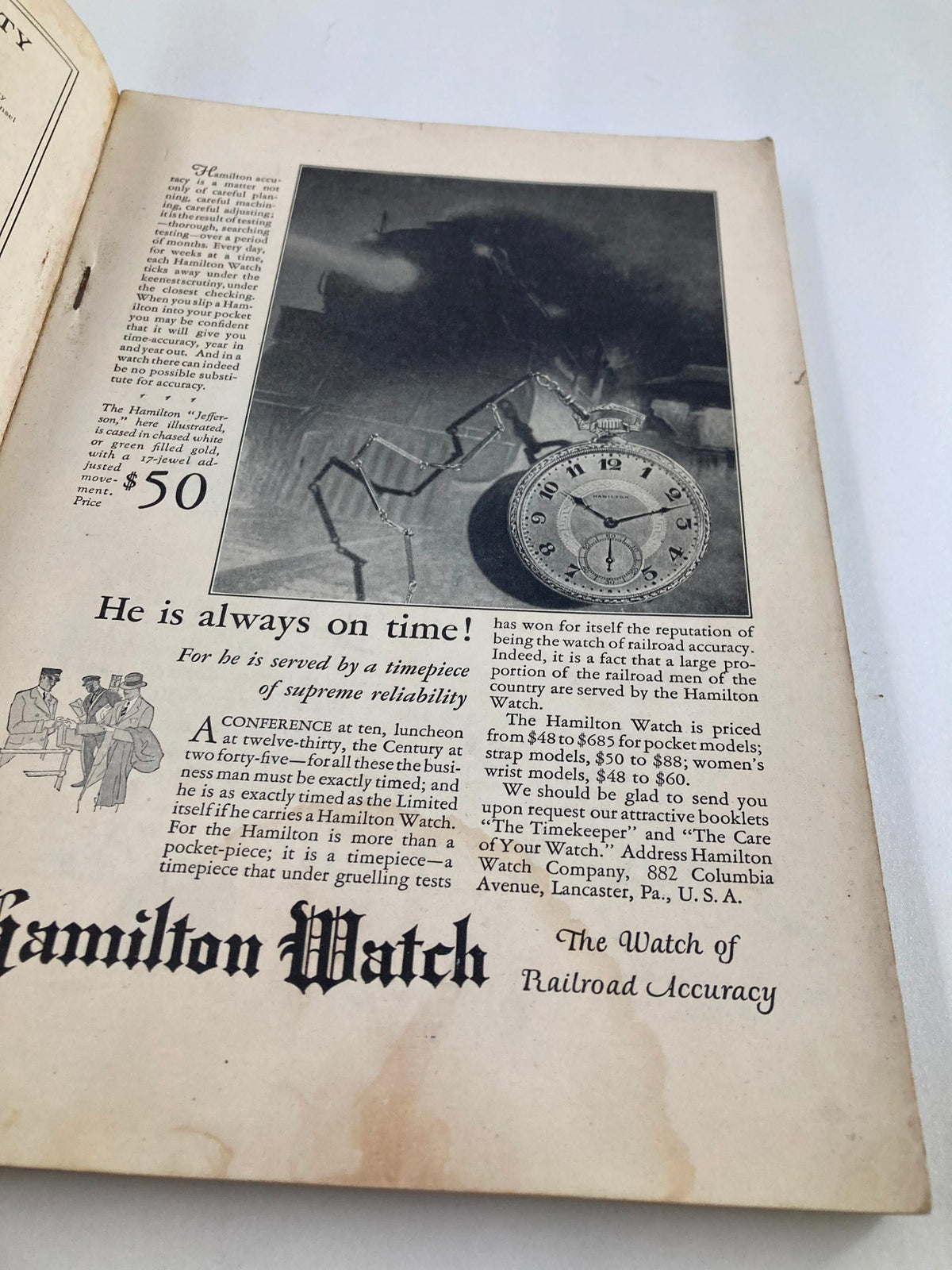 Vintage National Geographic Magazine March 1927 advertisement for Hamilton Watch showcasing a classic timepiece under the slogan 'He is always on time!' with a reference to supreme reliability.