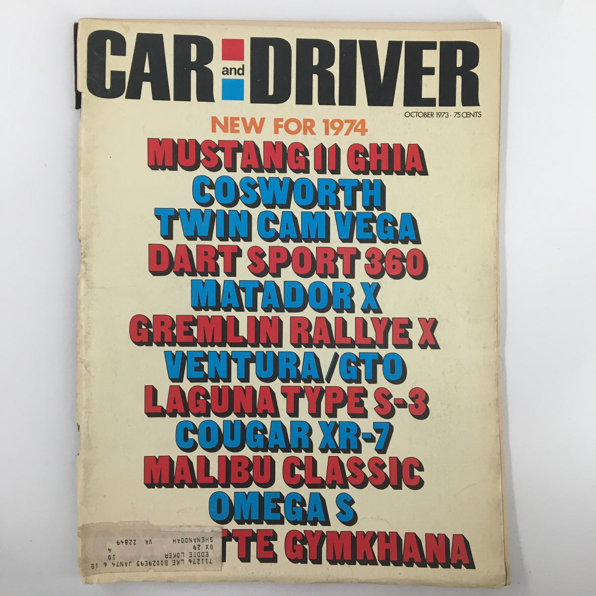 Cover of VTG Car and Driver Magazine from October 1973 featuring the Mustang II Ghia and Cosworth Twin Cam Vega. Highlights include automotive models and features from an iconic era.