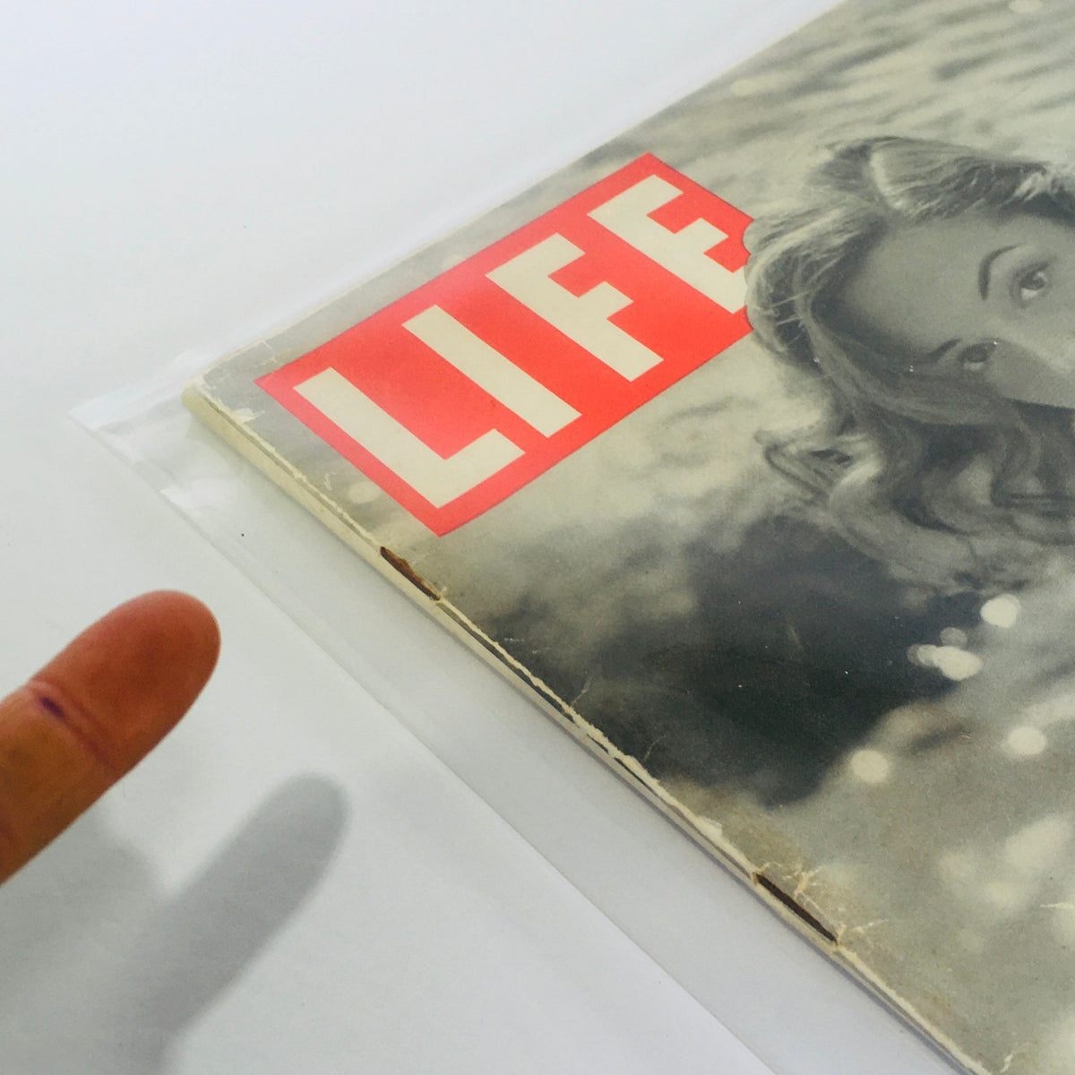 Side view of VTG Life Magazine from June 2, 1947 with actress Jane Greer on the cover, highlighting its vintage condition and protective casing.