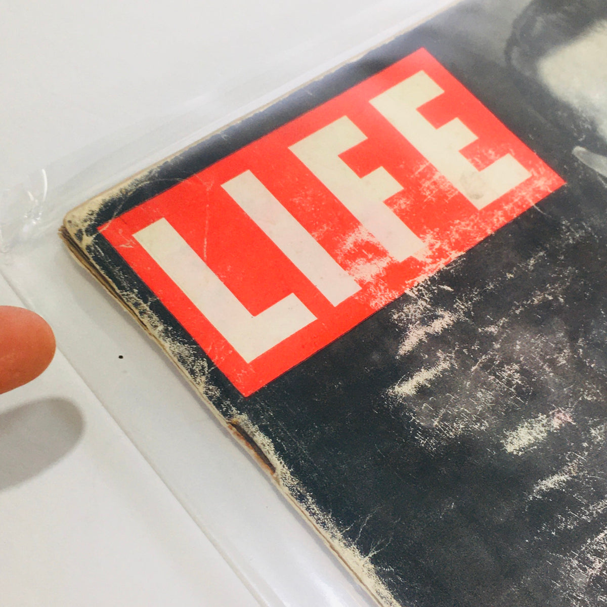 Close-up of the iconic cover of VTG Life Magazine: Nov 21 1949 featuring the bold 'LIFE' title, showcasing vintage wear and charm.