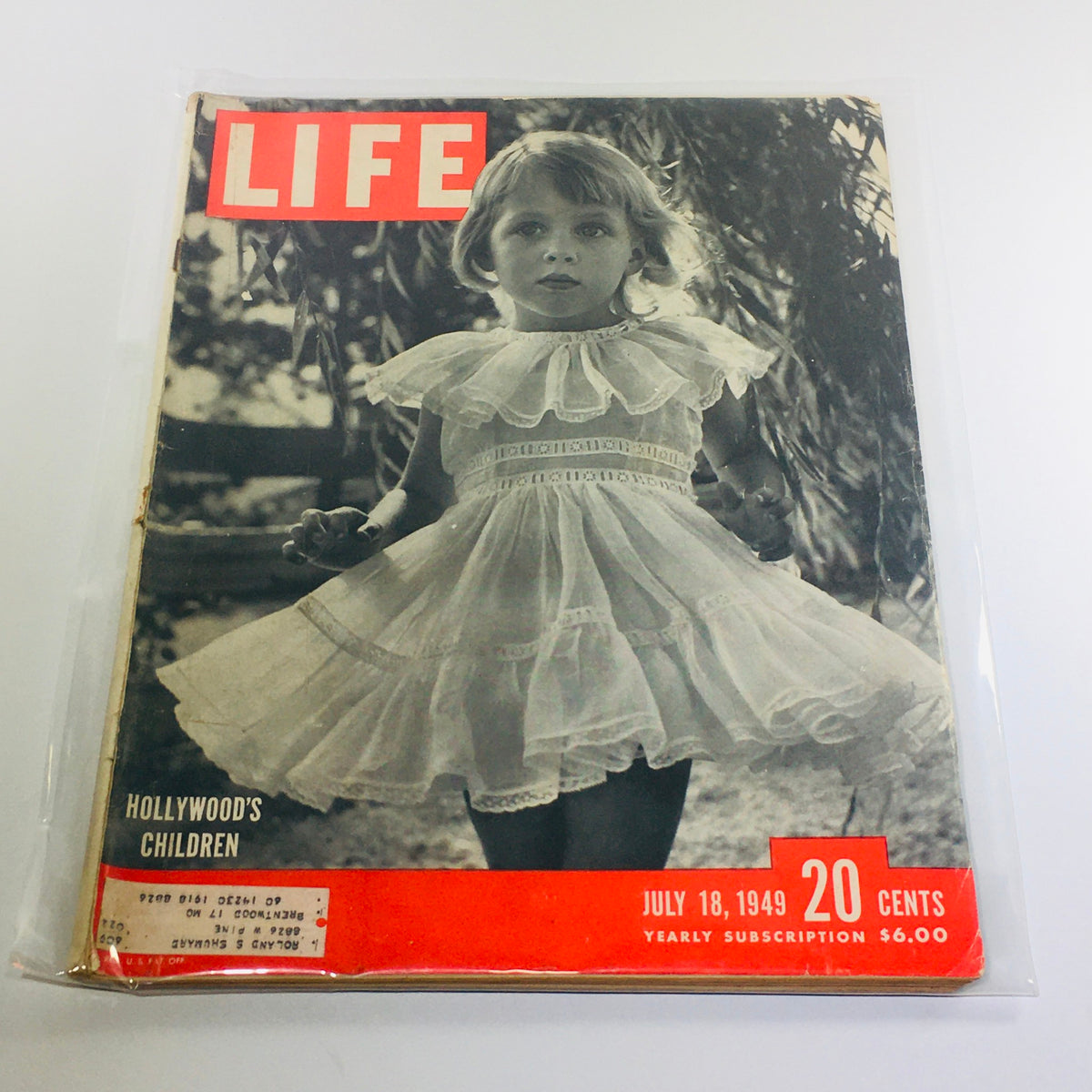 Vintage Life Magazine cover from July 18, 1949, featuring an image of a young girl in a white dress, highlighting Hollywood's Children and the Alger Hiss trial.
