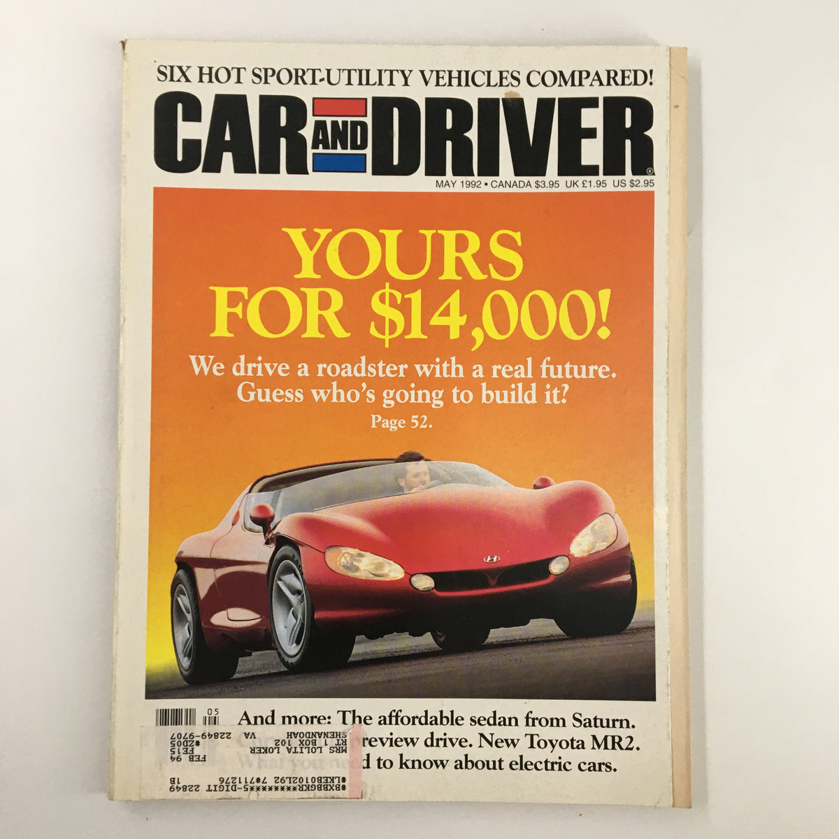 Car and Driver Magazine May 1992 cover featuring a red roadster and the headline 'Yours for $14,000! We drive a roadster with a real future. Guess who's going to build it?' Highlights the six hot sport-utility vehicles compared.