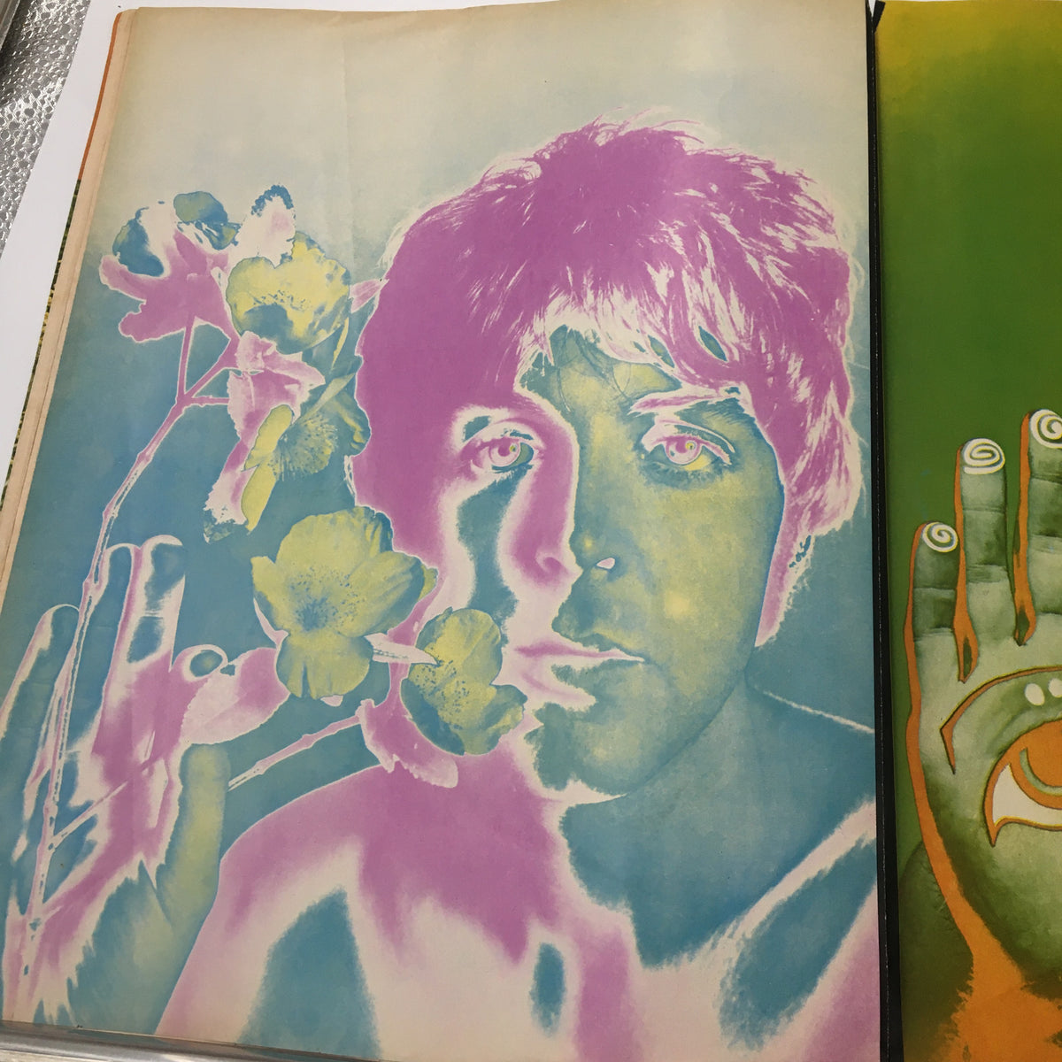 Vibrant artistic portrayal of Paul McCartney with flowers, featured in the VTG Look Magazine January 9 1968, emphasizing 1960s pop culture.