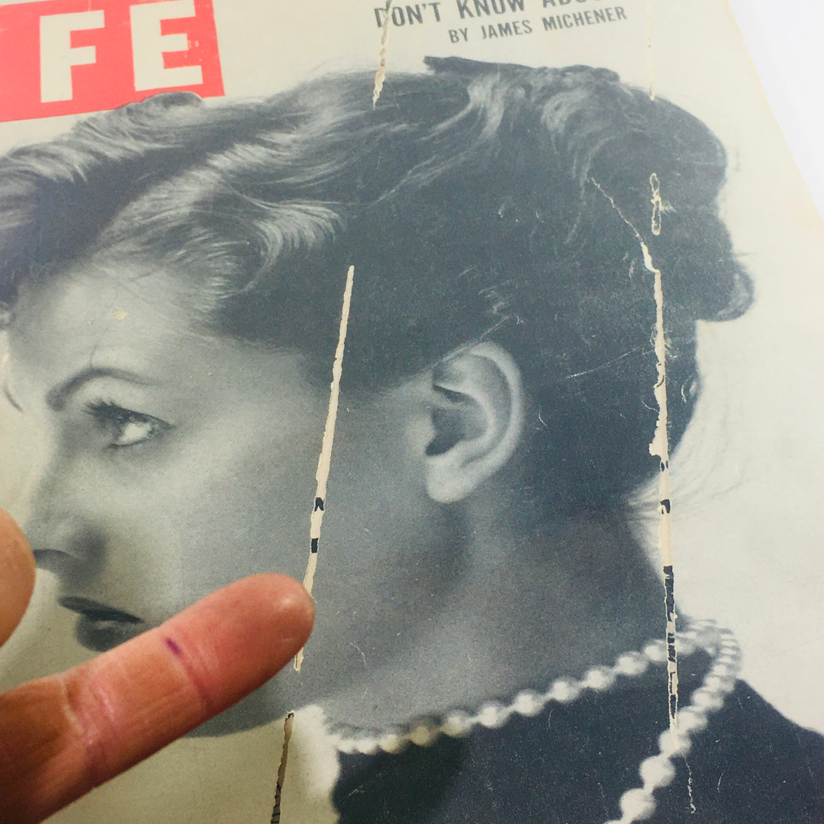 Detailed view of VTG Life Magazine cover from June 4, 1951, showing a rising German model with pearl necklace. The image illustrates signs of age and wear, capturing the essence of this collectible vintage publication.