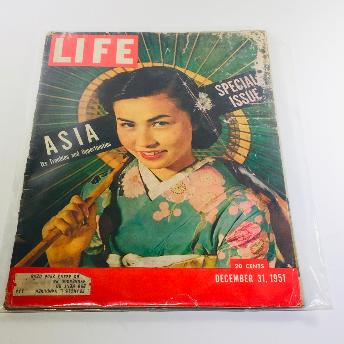Vintage Life Magazine cover from December 31, 1951, featuring the special issue titled 'Asia: Its Troubles & Opportunities,' showcasing a woman in traditional attire under an ornate parasol.
