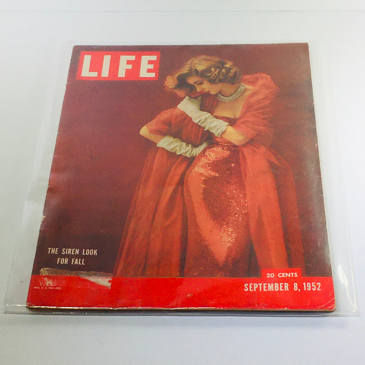 Vintage Life Magazine cover from September 8, 1952 featuring 'The Siren Look for Fall' with a glamorous model wearing a red dress and white gloves.