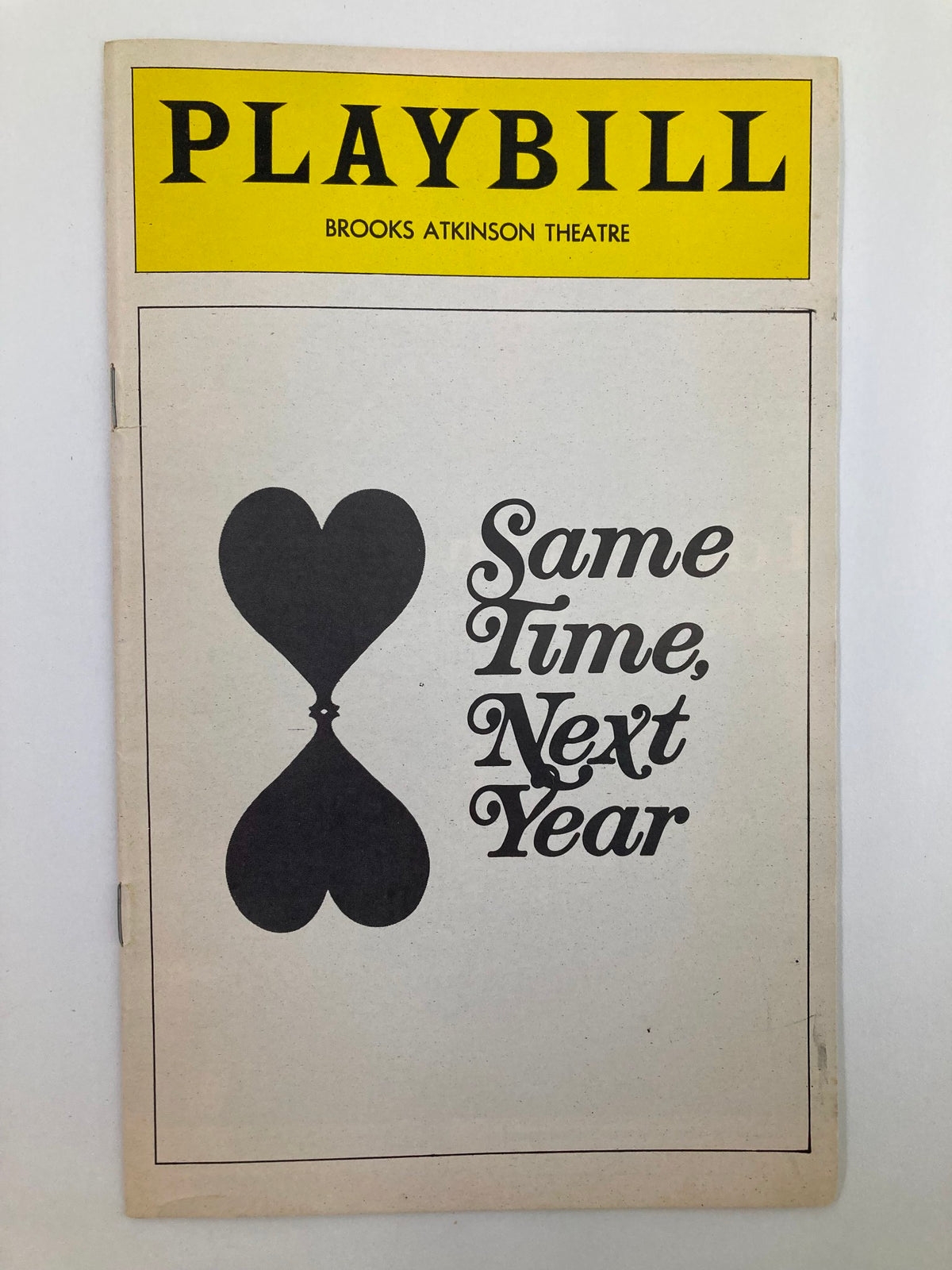 1975 Playbill for Same Time, Next Year at Brooks Atkinson Theatre featuring a design with a heart-shaped hourglass illustration.