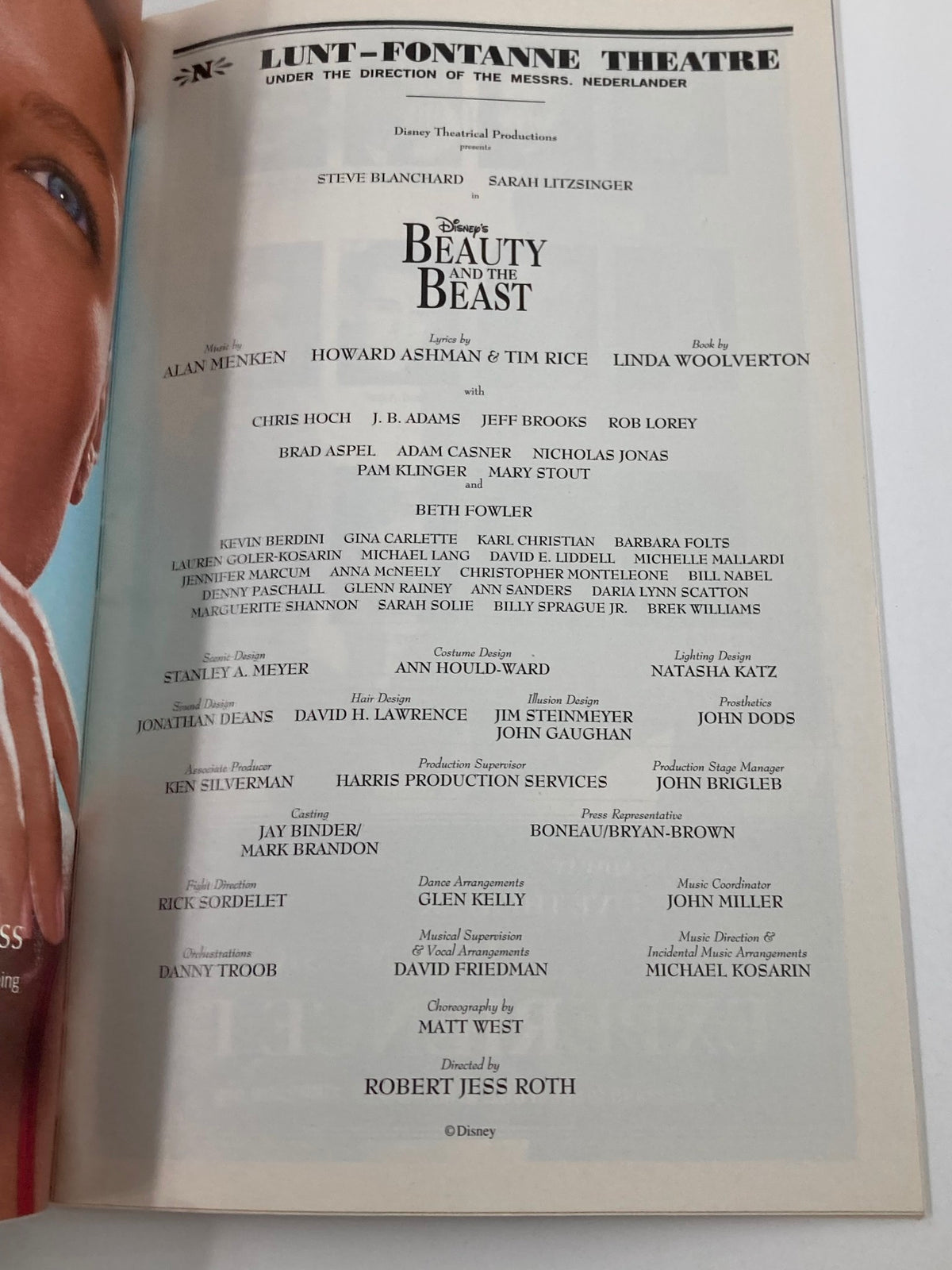 2002 Playbill from Lunt-Fontanne Theatre showcasing the cast and crew of Disney's Beauty and the Beast, with Steve Blanchard and Sarah Litzinger featured prominently under the direction of Robert Jess Roth.