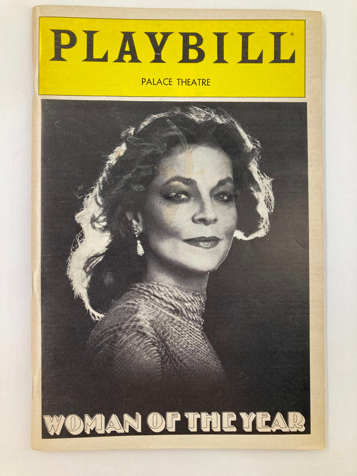 1982 Playbill for The Palace Theatre featuring Lauren Bacall in Woman of the Year, showcasing an iconic black and white photograph of Bacall.
