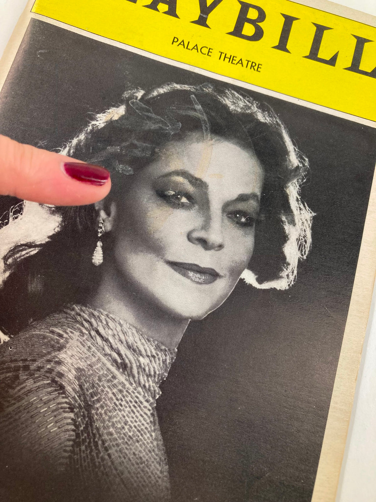 Close-up of the 1982 Playbill featuring Lauren Bacall, from The Palace Theatre production of Woman of the Year, highlighting her captivating expression.