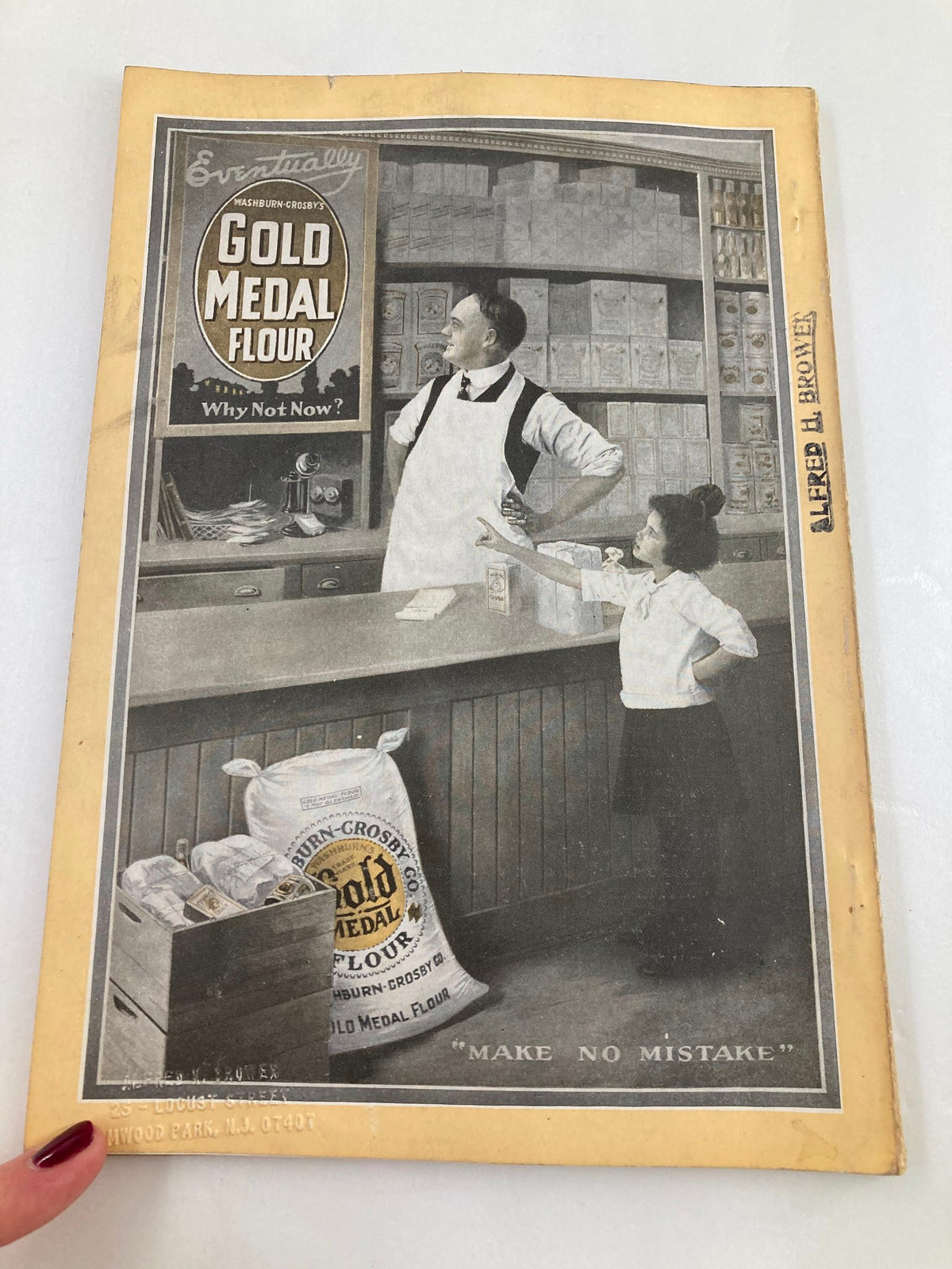 Vintage advertisement from the VTG The National Geographic Magazine June 1917, featuring a shopkeeper and a child promoting Gold Medal Flour, reflecting the era's marketing.