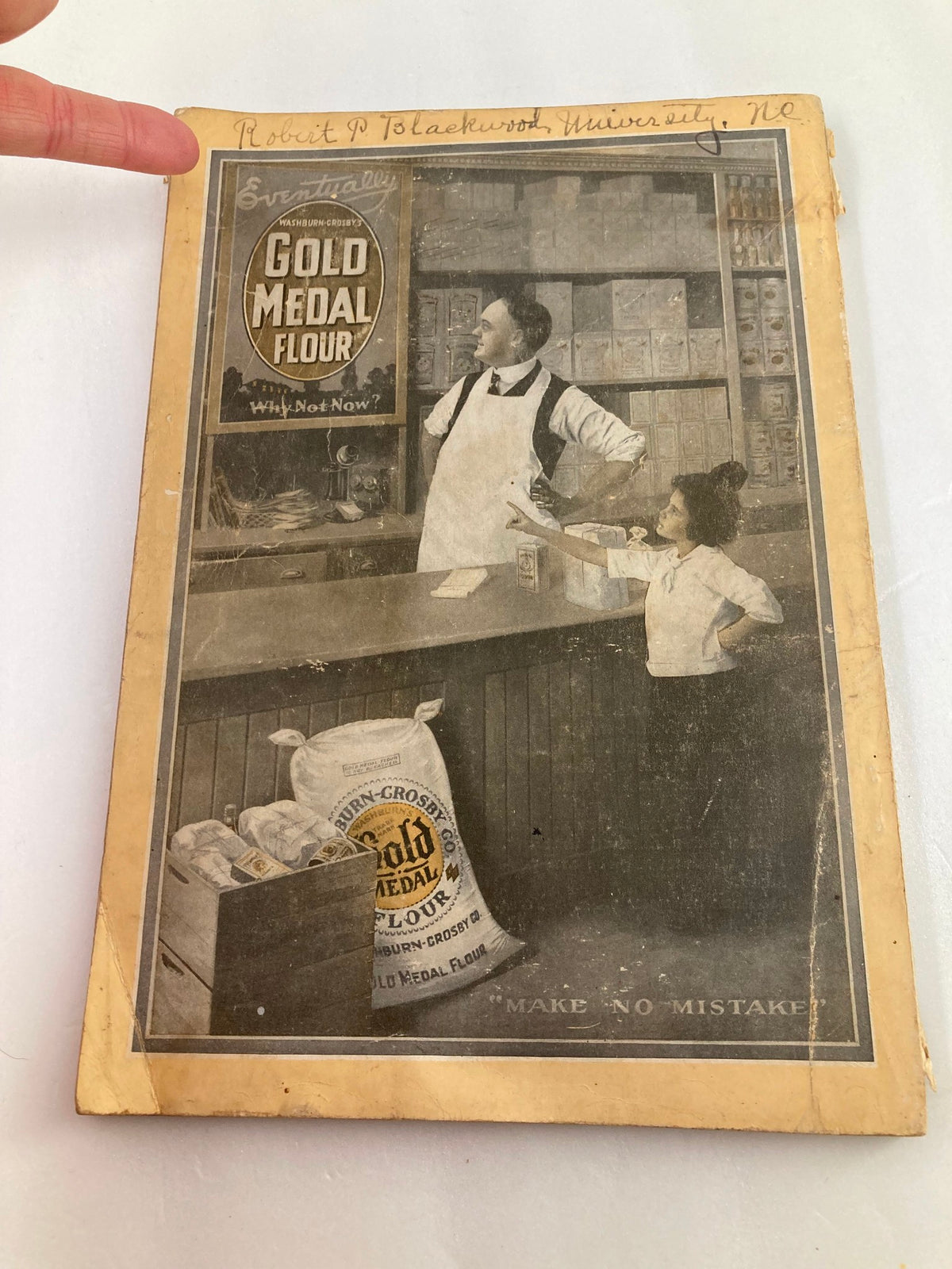 Cover of the vintage National Geographic Magazine June 1917, showcasing a nostalgic advertisement for Gold Medal Flour with a man and child in a grocery store setting.
