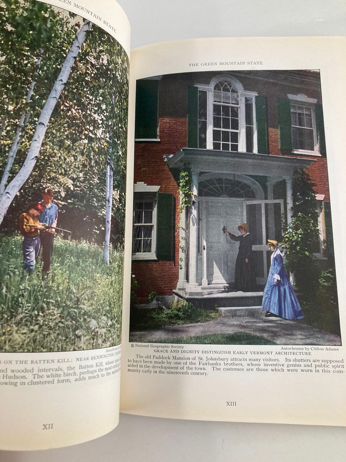 Image from VTG The National Geographic Magazine March 1927 showcasing the Green Mountain State with a picturesque scene of a man playing guitar outside a historic home.