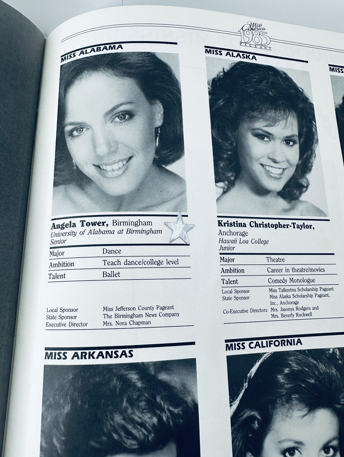 Detailed contestant profile page from The 1985 Miss America Pageant Magazine featuring Miss Alabama and Miss Alaska.