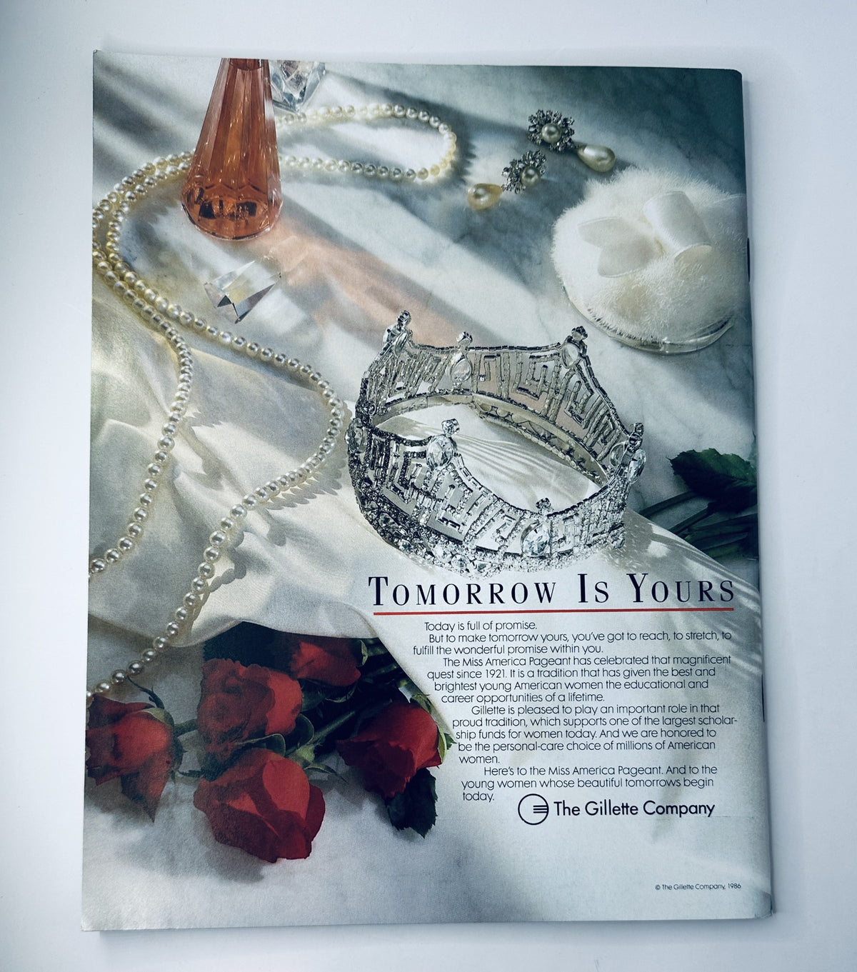 Back cover of The 1988 Miss America Pageant Magazine Program with the tagline 'Tomorrow Is Yours,' featuring a crown, pearls, and roses.
