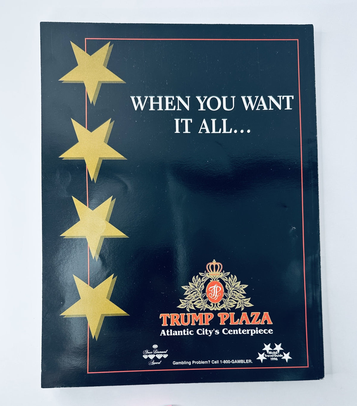 Cover of the Trump Plaza promotional material featuring a bold design with three gold stars and the text 'WHEN YOU WANT IT ALL...' highlighting its status as Atlantic City’s centerpiece. Perfect for memorabilia collectors.