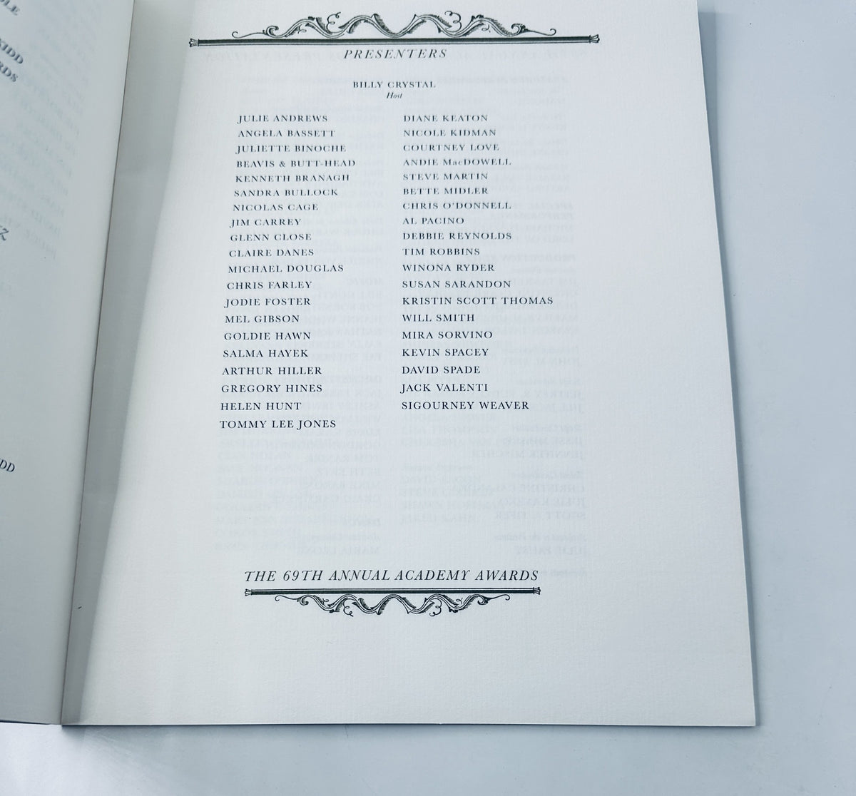 Presenters page from the Oscar 69th Annual Academy Awards Program Magazine, featuring names like Billy Crystal, Julie Andrews, Angela Bassett, and others, dated March 24, 1997.