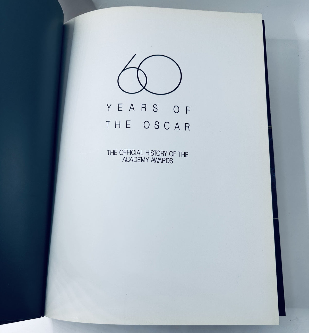 Title page of '60 Years of the Oscar: The Official History of the Academy Awards', presenting the book's title prominently.