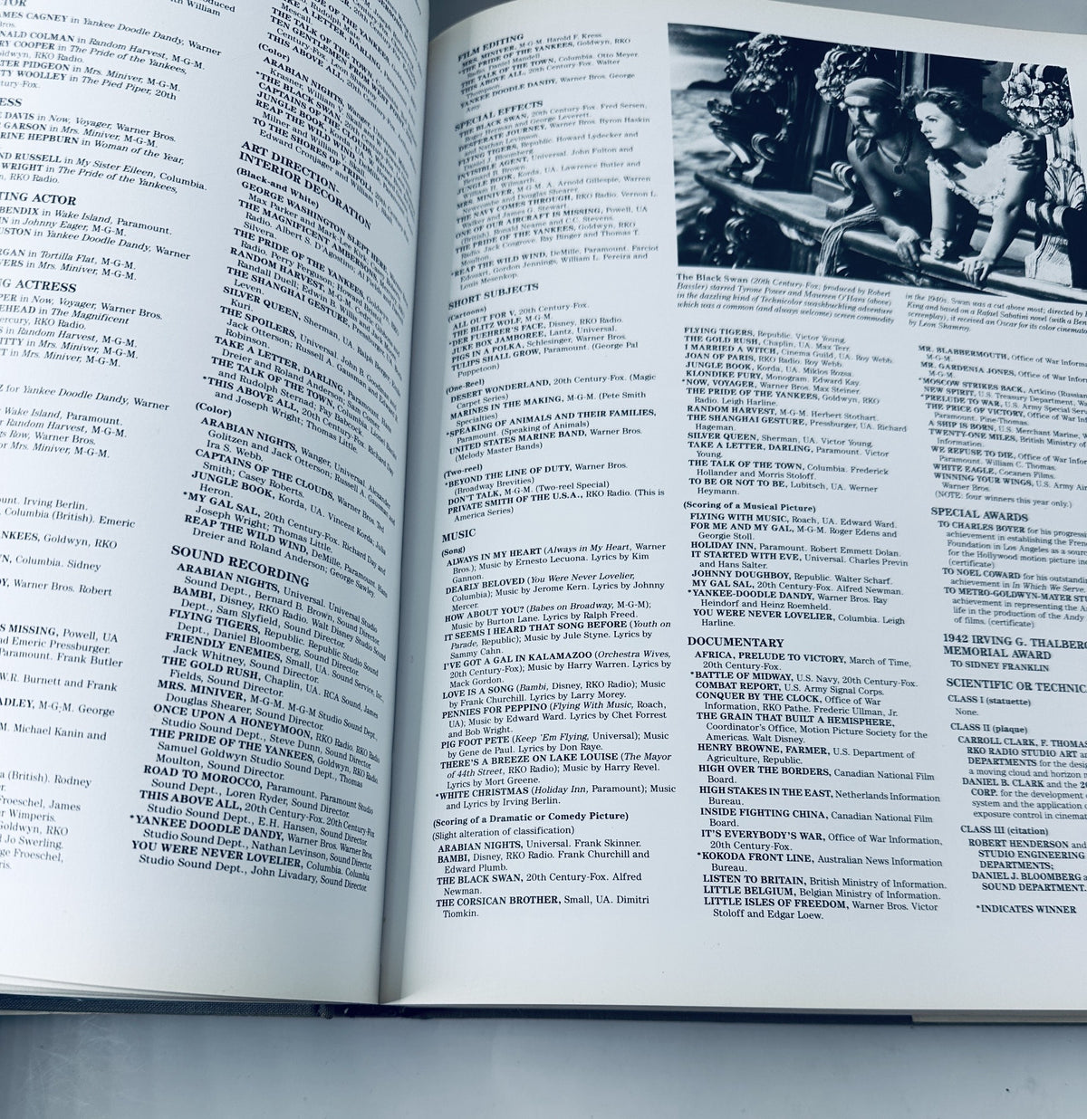 Interior page of '60 Years of the Oscar' listing various award categories along with past nominees and winners, highlighting significant films.
