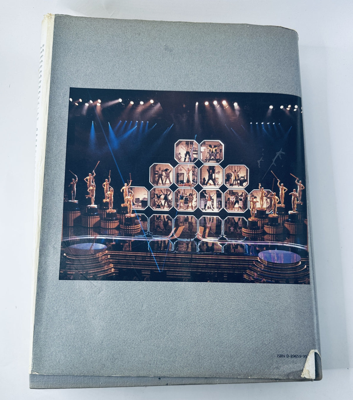 Cover image of '60 Years of the Oscar's 1989 Official History Academy Awards Book' featuring an iconic awards stage with dramatic lighting.