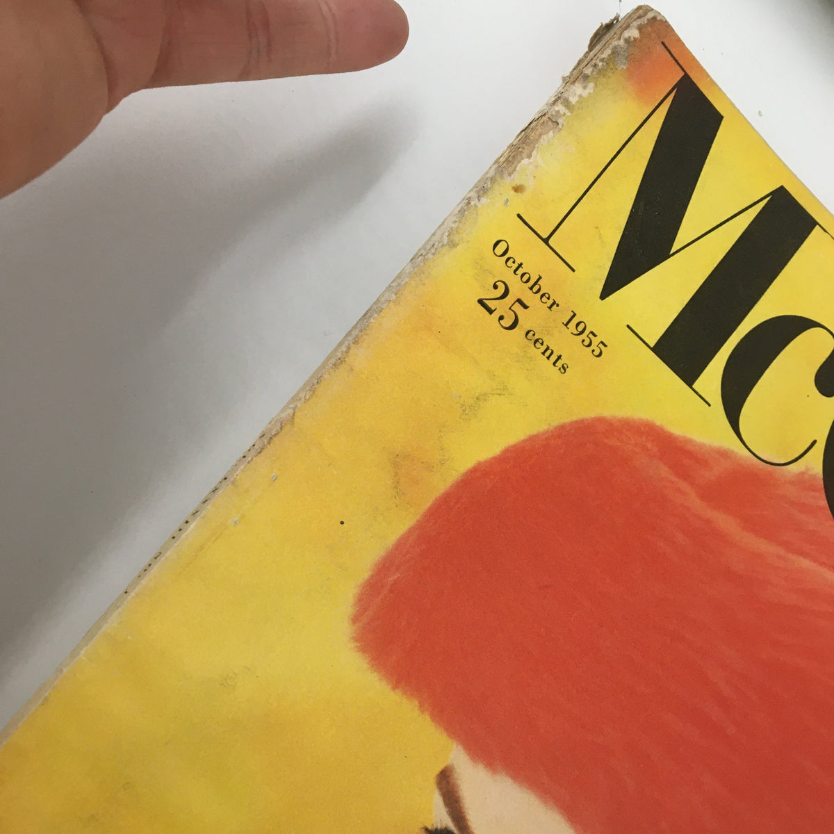 Close-up of the top corner of the October 1955 VTG McCall's Magazine cover, highlighting the date and price, with minor wear visible indicative of its vintage condition.