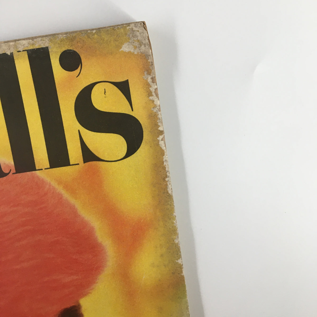 Detailed view of the side of the October 1955 VTG McCall's Magazine cover, emphasizing the wear and vintage charm, including the magazine title in bold lettering.