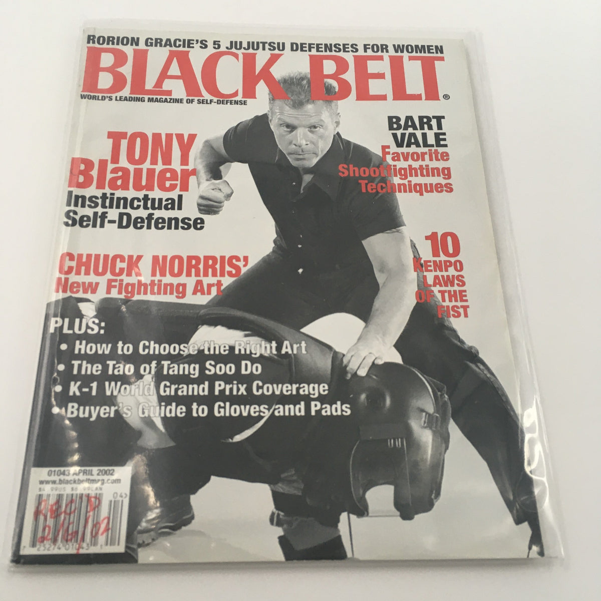 Cover of Black Belt Magazine April 2002 featuring Tony Blauer on instinctual self-defense, along with articles on Bart Vale's shooting techniques and Chuck Norris' new fighting art.