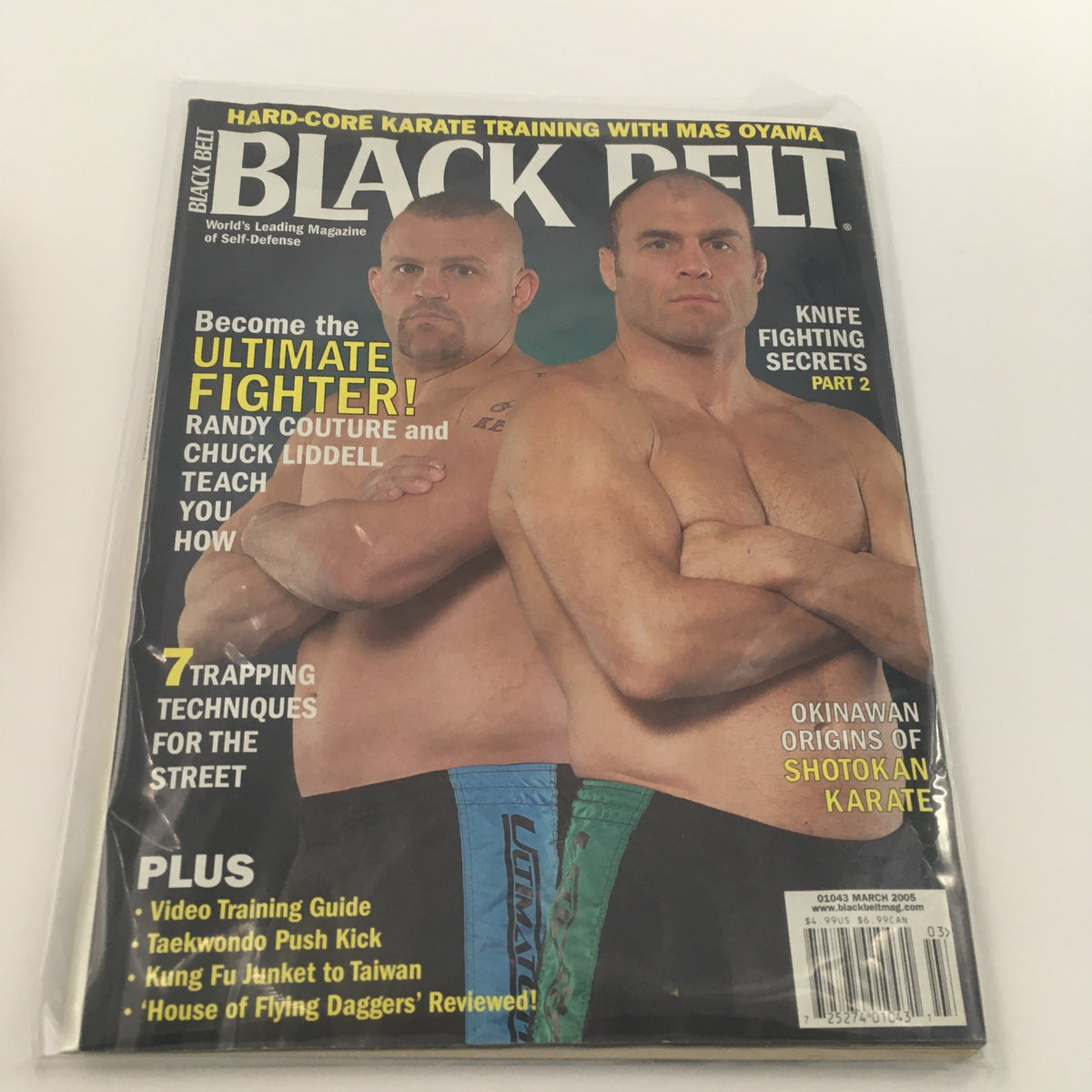 Cover of Black Belt Magazine March 2005 featuring Randy Couture and Chuck Liddell. The magazine highlights martial arts techniques and training, showcasing two iconic fighters from the MMA world.