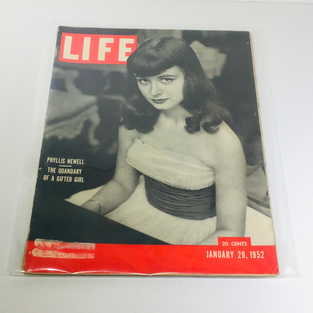 Cover of Life Magazine dated January 28, 1952, featuring the article 'Phyllis Newell: The Quandary of A Gifted Girl', showcasing a vintage design with prominent red and black colors.