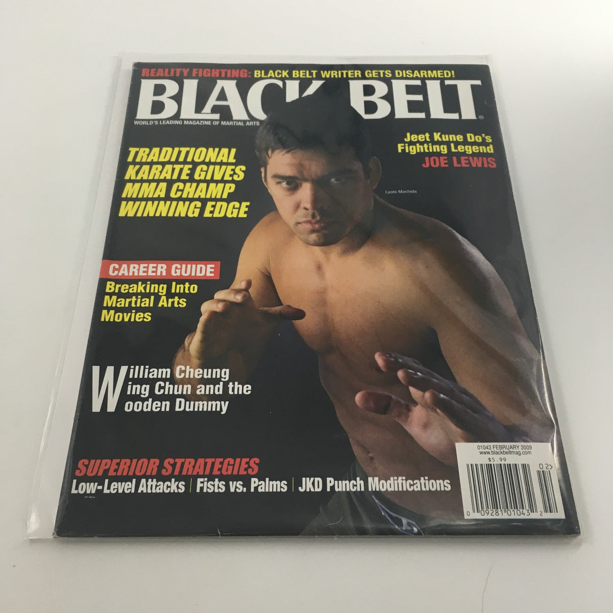 Black Belt Magazine February 2009 issue featuring Lyoto Machida on the cover, showcasing martial arts themes and strategies.