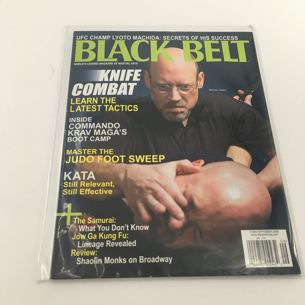 Black Belt Magazine September 2009 featuring an image of Michael Janich demonstrating knife combat techniques, showcasing martial arts skills on the cover.
