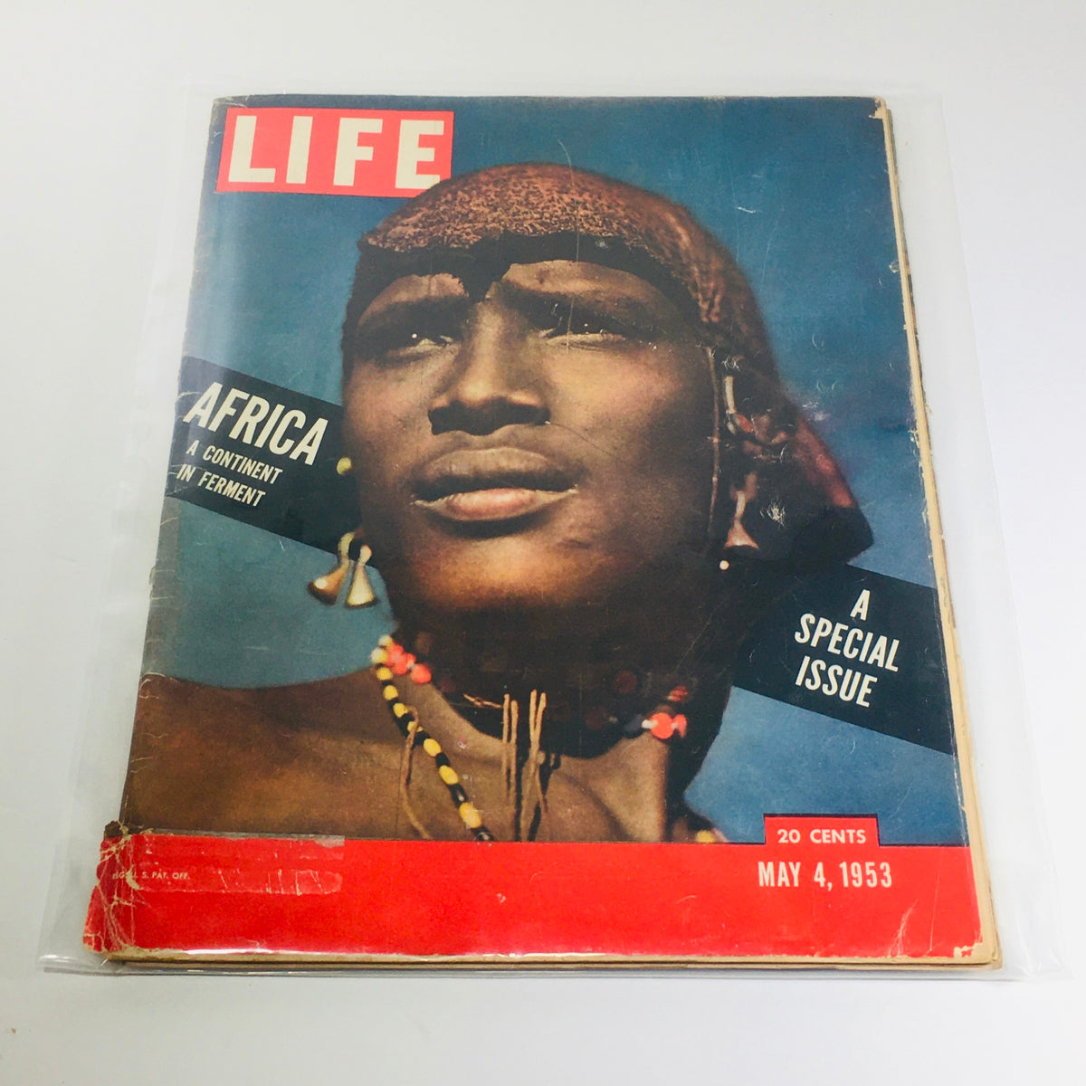 Vintage Life Magazine Cover from May 4, 1953, featuring the special issue titled 'Africa, A Continent in Ferment.' The cover displays a portrait of an African man adorned with traditional jewelry and attire.